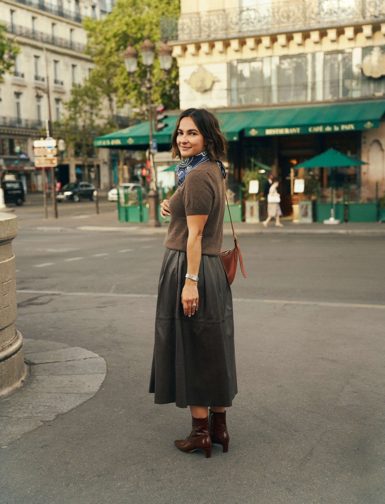 A little Parisian-inspired fall outfit featuring a cozy short-sleeve sweater, a leather midi skirt, and sleek ankle boots. I added a printed silk scarf for a pop of color and pattern, plus a warm brown bag to tie everything together. This is such a chic combination for dinner, drinks, or a day in the city.  

 #LTKootd #LTKSeasonal