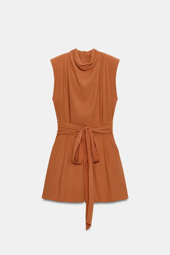 High-neck sleeveless jumpsuit with shoulder pads and pleats. Features a matching fabric belt. Fro... | Zara US
