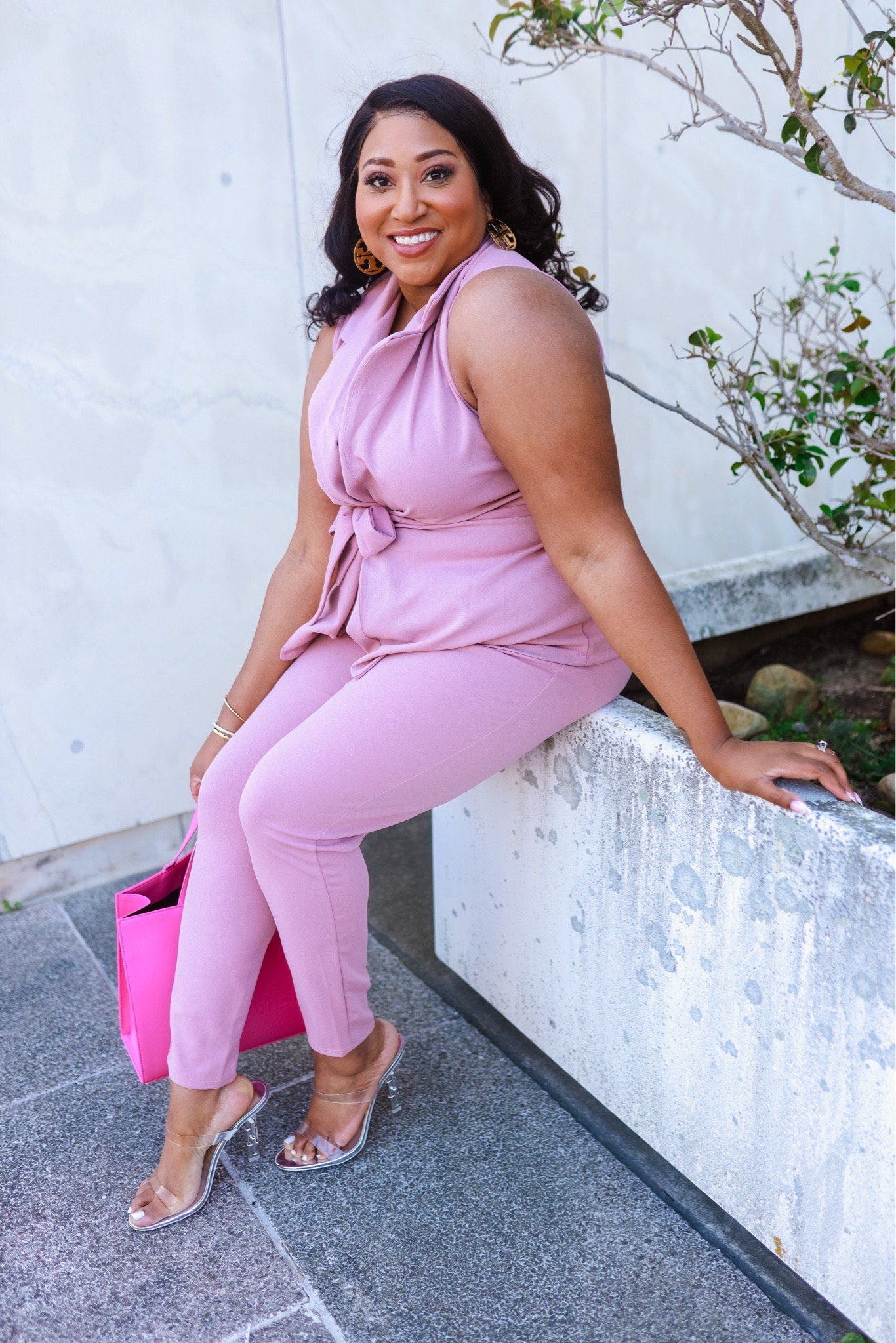 A pink power suit is always in! 

Clear heels, pink tote bag, curvy style, work wear, spring style