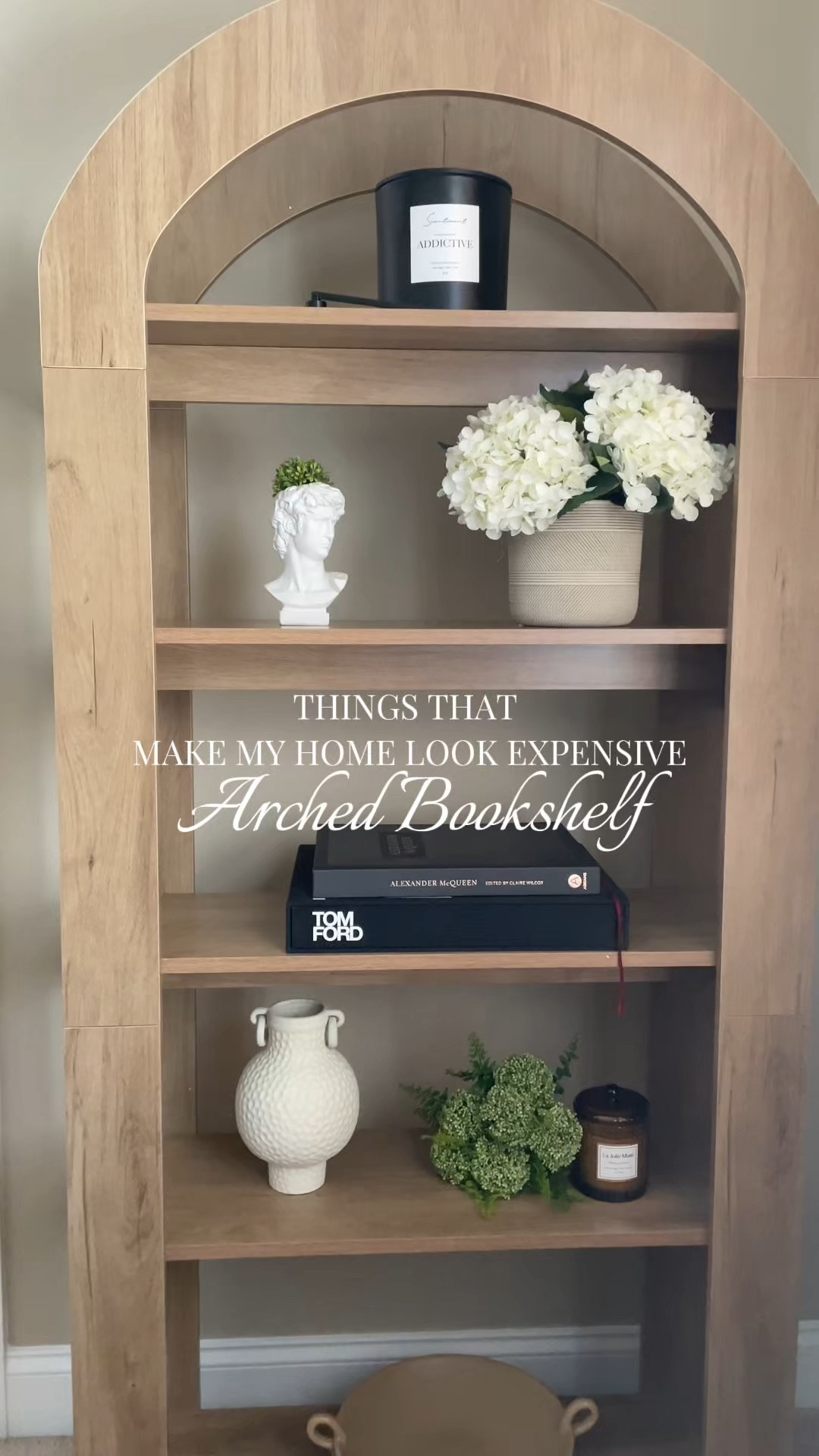 Vertical decor for the win 🙌🏻 This affordable arched bookshelf gives designer vibes and adds height to this empty corner as well as the ability to add curated interior styling to the room  

#LTKHome #LTKvlog #LTKSaleAlert