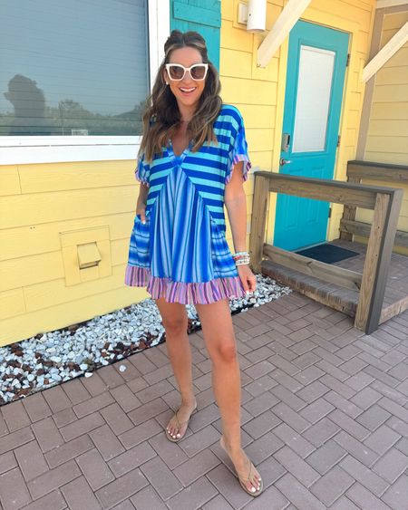 In a medium deep v neck mini dress, large 2 piece swimsuit underneath, sunglasses, sandals and accessories for spring beach day - all fits TTS.

#LTKstyletip #LTKfindsunder50 #LTKSeasonal