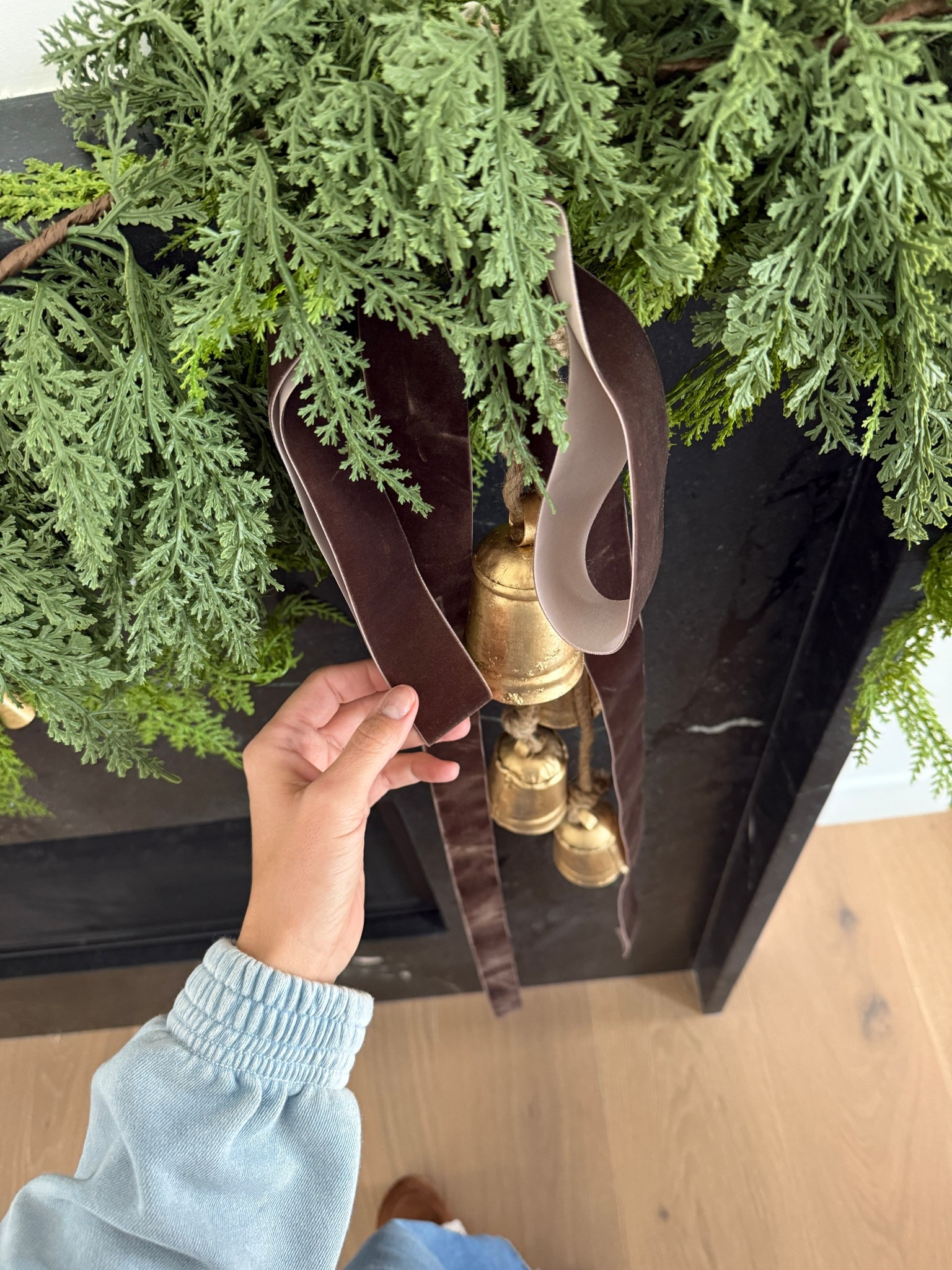 Christmas 2025 mantle is ready! Love the full look but nothing over the top, added brass bells and some olive green this year- the dark brown velvet ribbon is a favorite too 

#LTKHoliday #LTKHome

#LTKHoliday #LTKHome