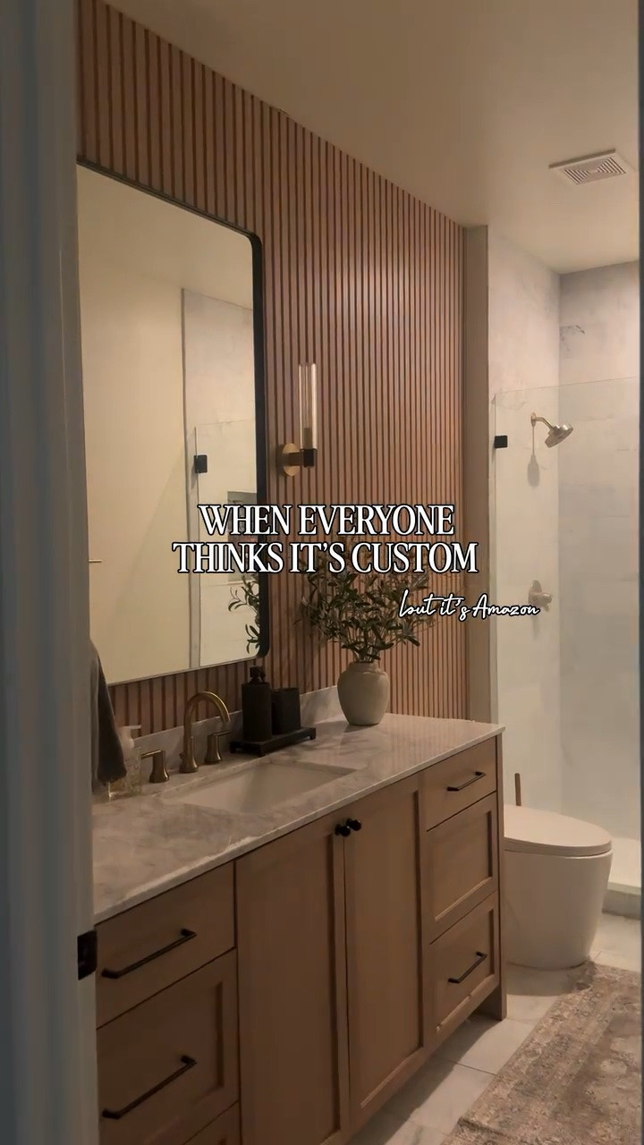 Everyone thinks this wall was custom built… but it’s actually an easy Amazon upgrade.

This completely changed the feel of our bathroom and made the entire space look more high-end without a massive renovation.

designer look · warmer texture · custom feel

One of the most asked-about details in our home for a reason.

@lowes @Target @Wayfair @walmart
@delta