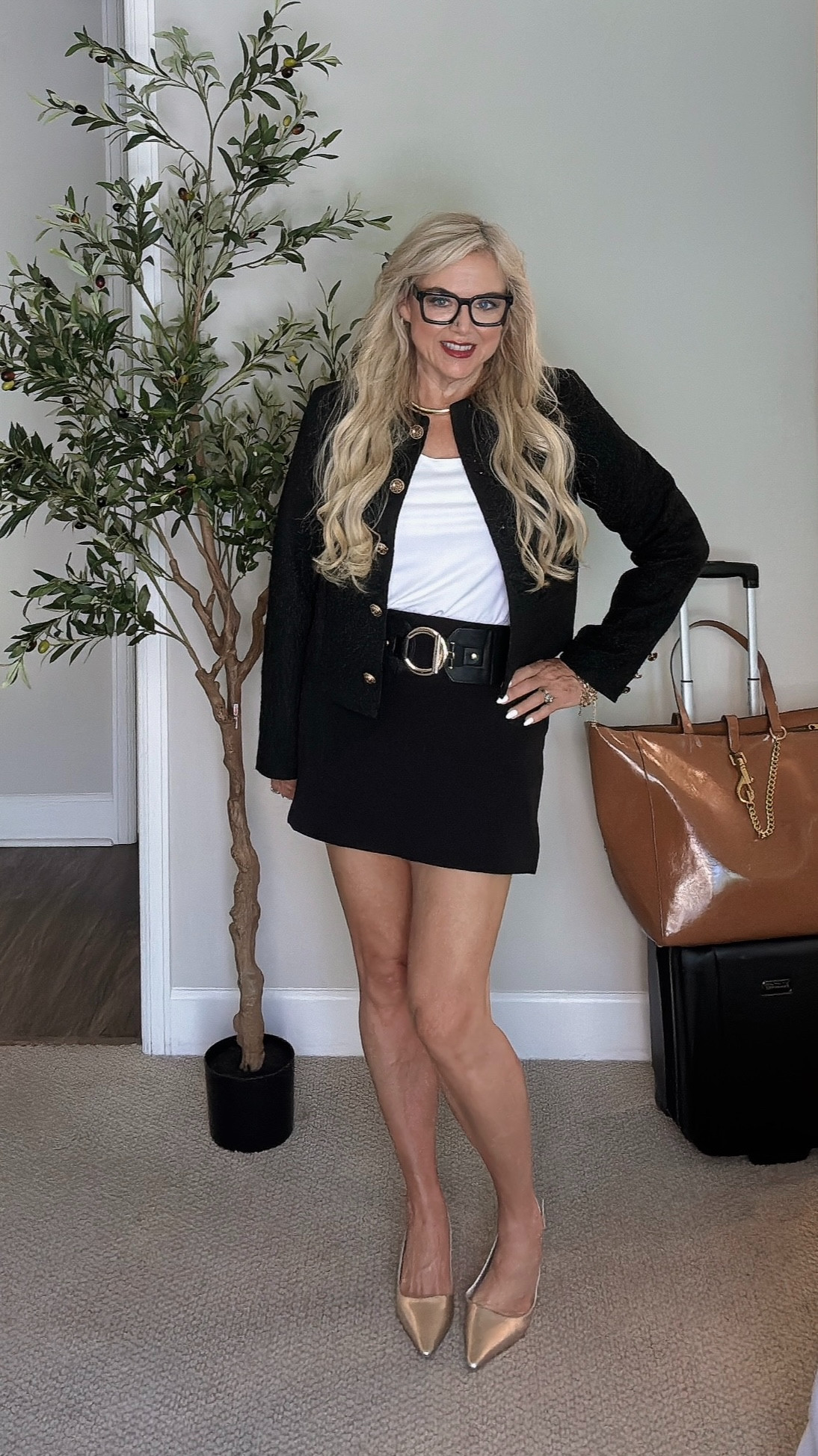 Love this tweed cropped jacket! (L) I have linked a couple of others of brands that I love as well. Skort (M) is super comfortable with some stretch and love the accent of the belt. The tote bag that I'm using for travel is the weekender from Rebecca Minkov, but I've linked a similar one which is slightly smaller. 

 #LTKOver40 #LTKWorkwear #LTKTravel