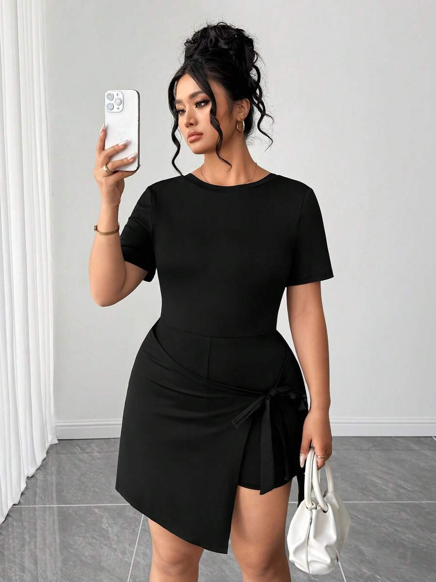 Elenzga Plus Size Women Solid Color Round Neck Short Sleeve Casual Asymmetric Hem Jumpsuit | SHEIN