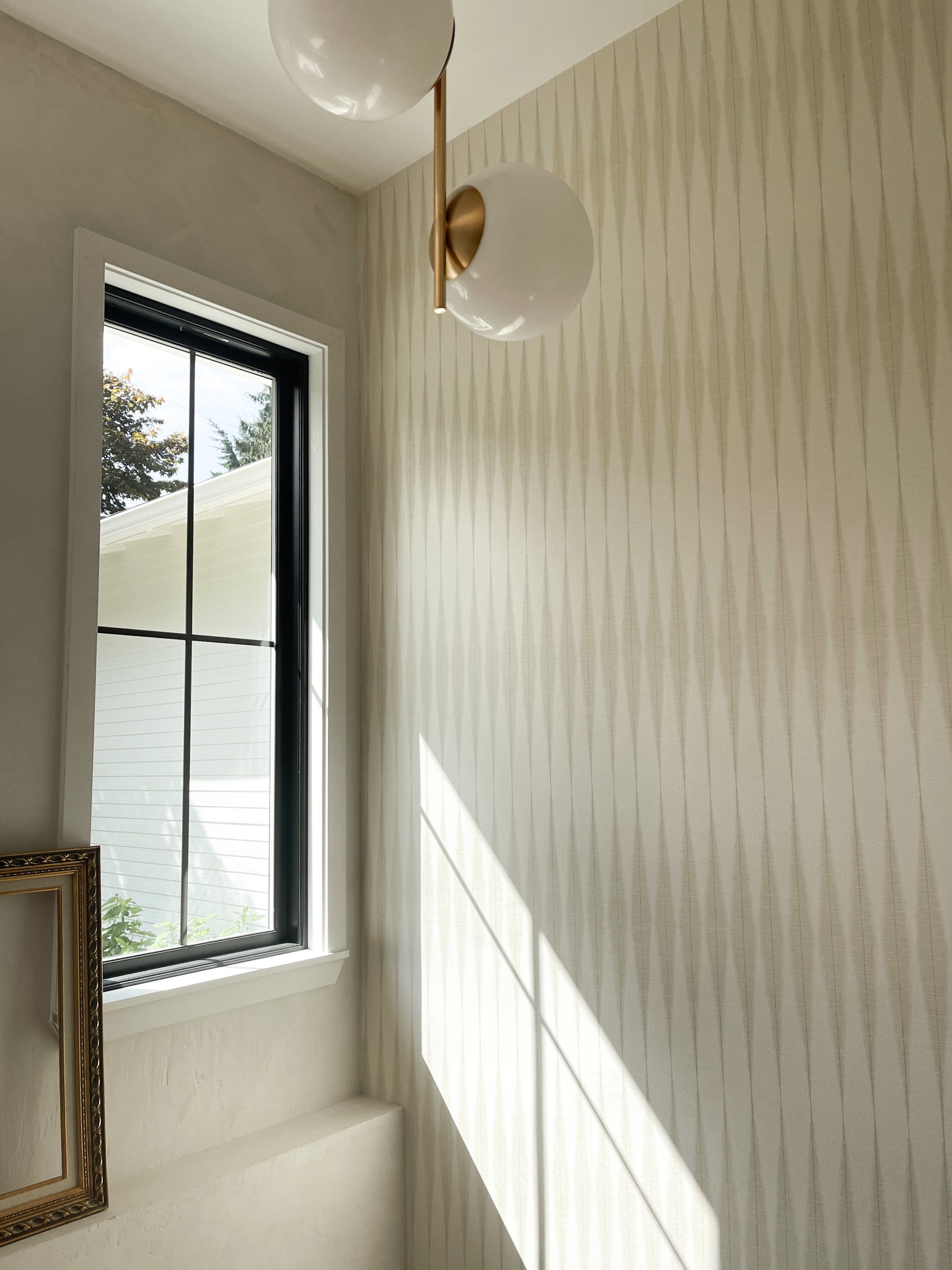 west elm light fixtures are the best w/o breaking the pocket book. this MCM pendant plays perfectly w/ this neutral accent wall.

#LTKhome