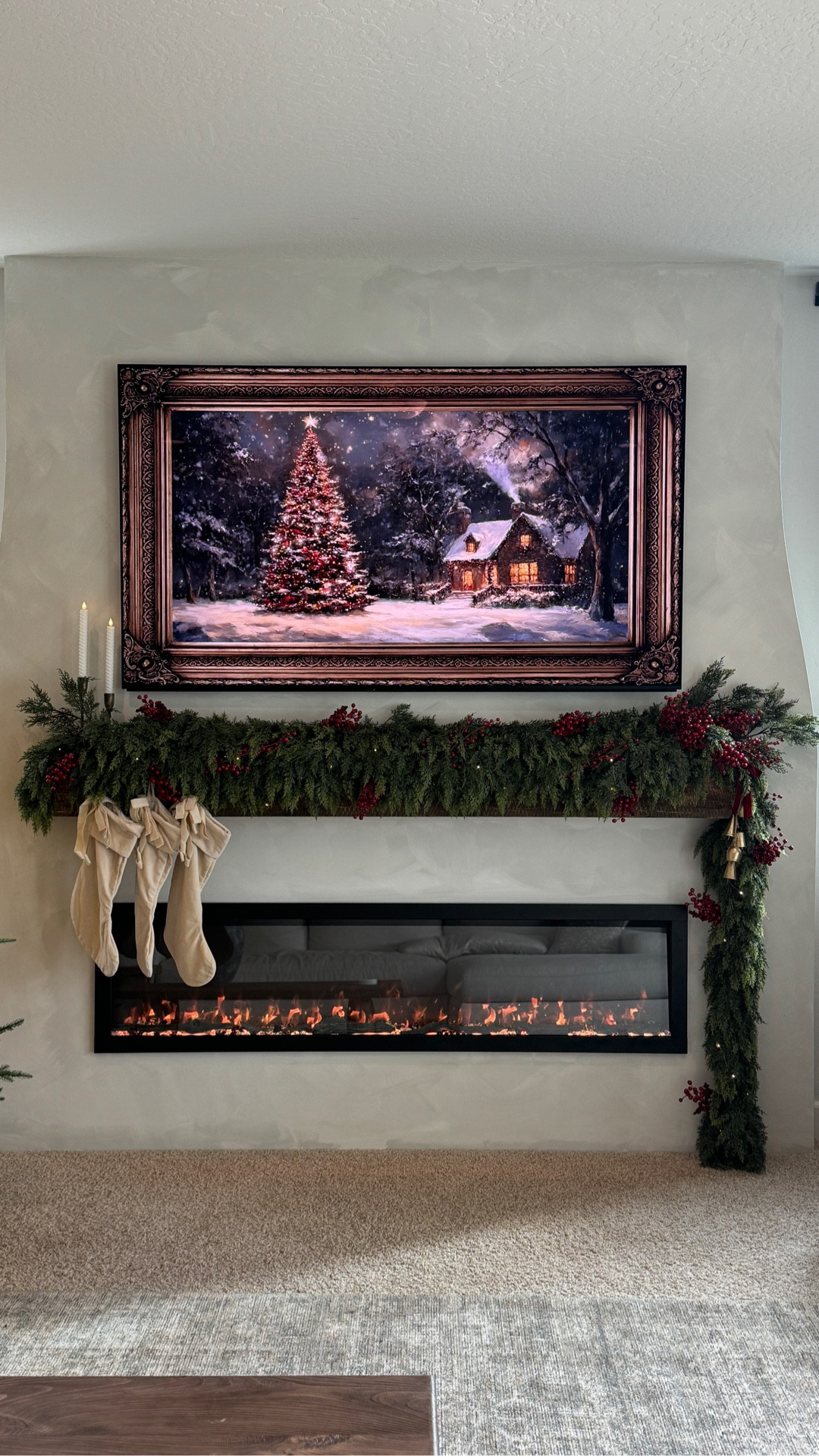 The first Christmas mantel I created in our new home 🥹 

I used one 9 ft cedar garland at the bottom then layered with a 6 ft cedar garland on top. I then added a 3rd cedar to the right side to hang off and make this an asymmetrical look. I also added a few cedar stems and red berry stems. For the lights - I used the $3 fairy twinkle lights from Target. The wire is so thin and it's easy to hide. They are battery operated and I just used two strands here.