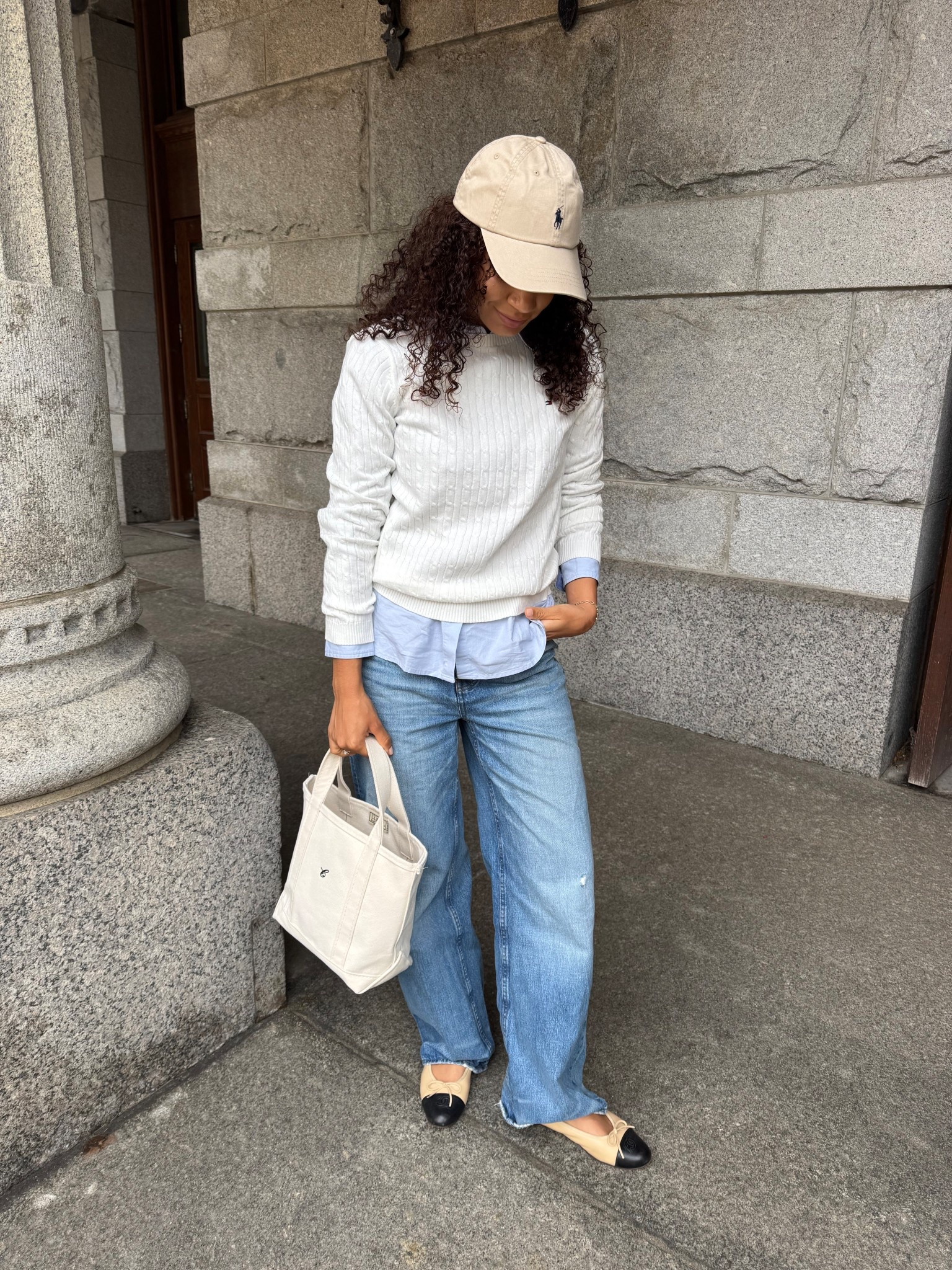 Casual chic spring outfit idea with baggy jeans, cap toe flats, button up, sweater, Ralph Lauren baseball cap 

#LTKootd