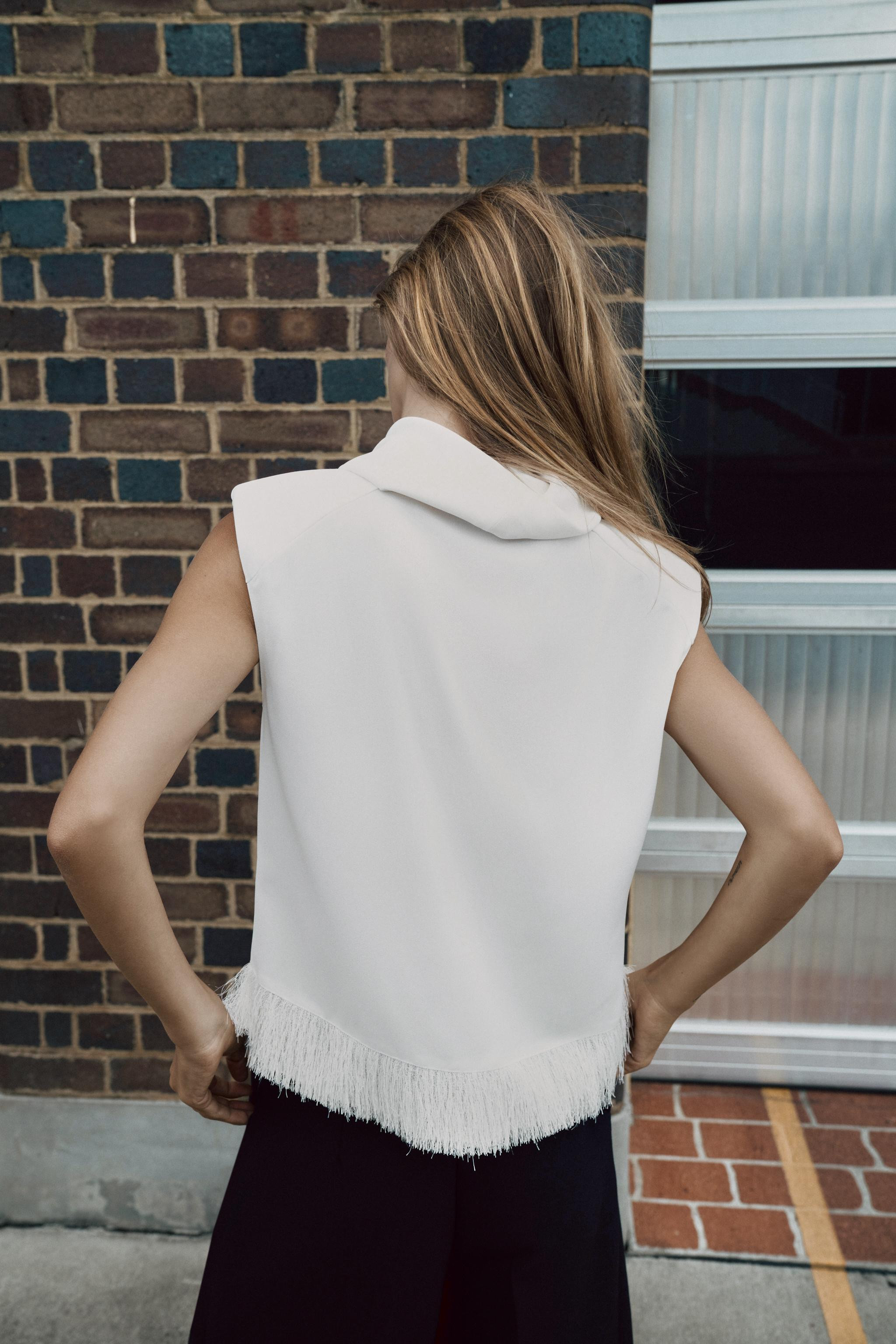 TOP WITH SHOULDER PADS AND FRINGING | Zara UK