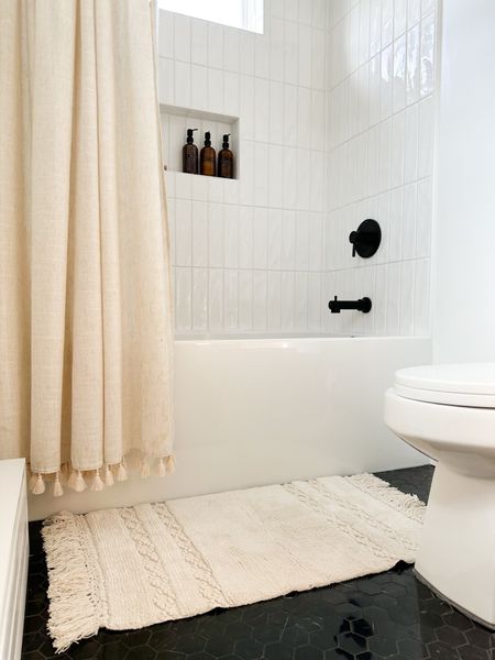 Master bath shower details - simple & neutral design. 
Shampoo amber bottles - Amazon  
Shower curtain - Target. 
Bath mat - Walmart. 

#LTKhome #LTKfindsunder50 #LTKstyletip