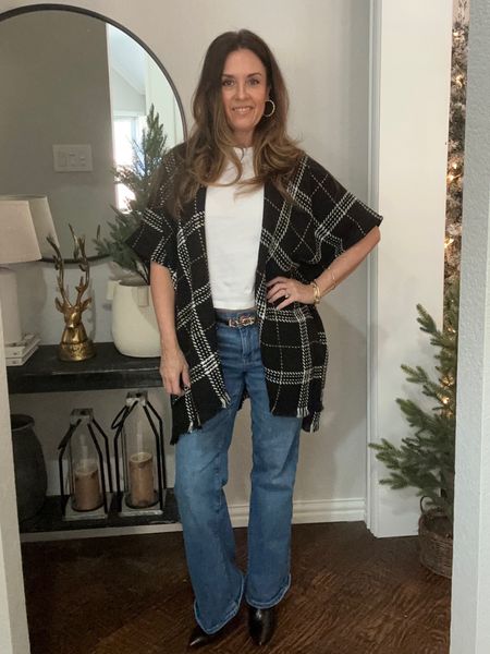 Fall fashion outfit with trending plaid
Ponchos, basic T-shirt and flare jeans. Pointed toe black booties complete the look 

#LTKSeasonal #LTKover40 #LTKstyletip