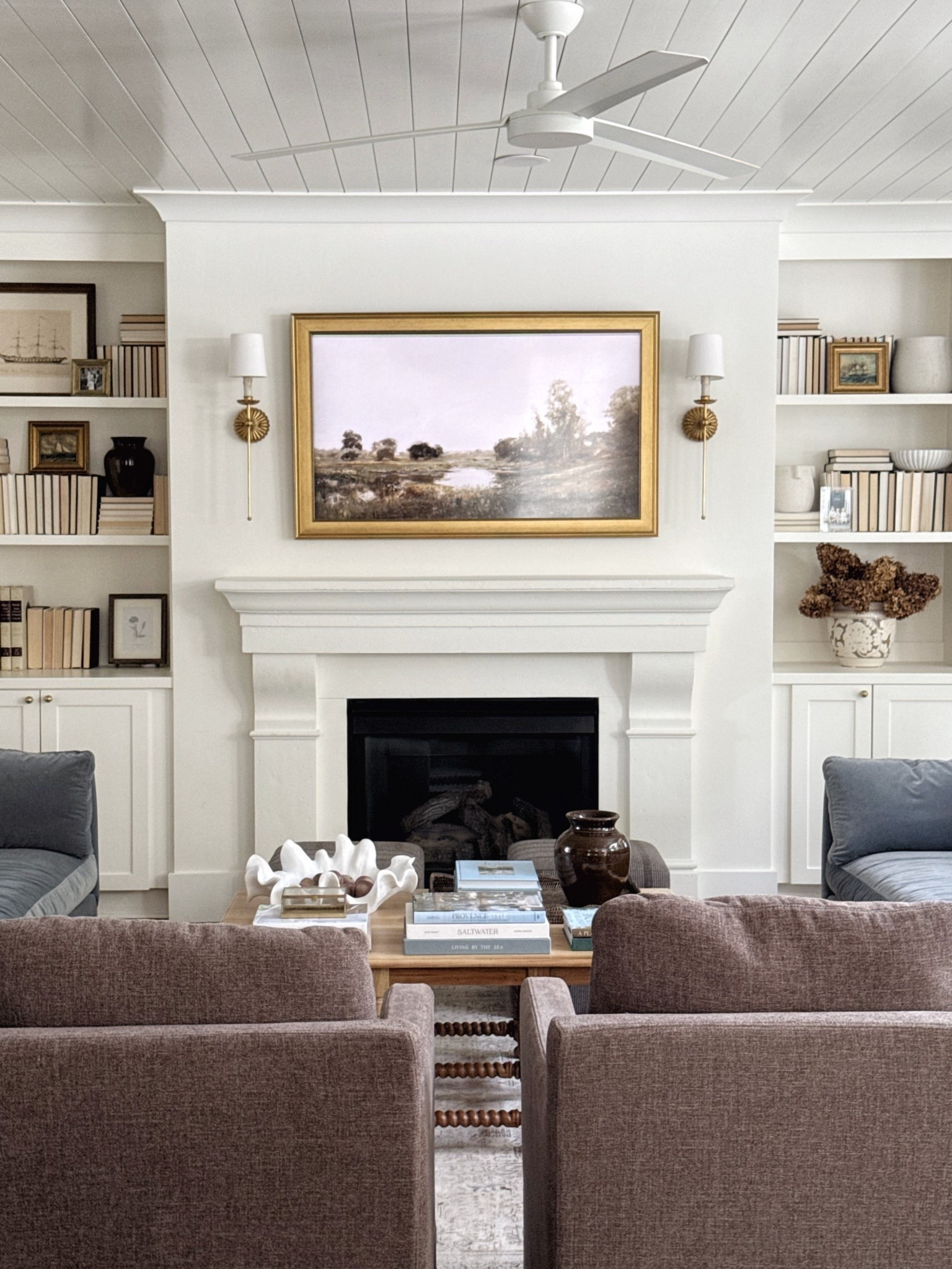 Fall living room! Neutral fall Frame TV art, brown swivel chairs, fall decor, wood coffee table, brass sconces 

#LTKHome #LTKStyleTip #LTKSeasonal