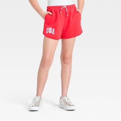Girls' French Terry 4th Of July "USA" Graphic Cutoff Dolphin Pull-On Shorts - art class™ Red (Beach Pink) S | Target