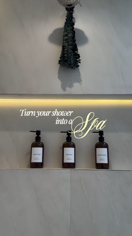 I have the easiest way to make your bathroom feel more luxurious… sometimes it’s the small details. 

Adding eucalyptus to your shower not only looks beautiful, but the steam can help release its natural aroma, creating a calming, spa-like experience at home. I also swapped out mismatched shampoo, conditioner, and body wash bottles for simple refillable dispensers, and it’s amazing how much more elevated and organized everything feels.

If you’re looking for affordable ways to upgrade your bathroom, start here:

-Hang fresh or dried eucalyptus from your showerhead (don’t place it directly under the water)
-Use matching refillable bottles for shampoo, conditioner, and body wash
-Keep accessories simple and intentional instead of cluttered

These are inexpensive changes, but they completely transformed how this space feels for me. After a long day of work, kids, and everything in between, having a bathroom that feels calm, clean, and relaxing has become a little form of everyday self-care.

You don’t need a luxury hotel or an expensive renovation to create a spa-like retreat at home. Sometimes a few thoughtful details are all it takes. 🤍

#bathroomdecor #spabathroom #bathroomideas #showeraccessories #homeinspiration