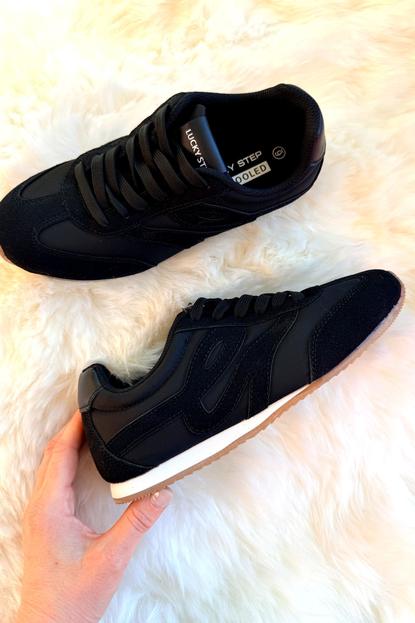 All black, but with just enough detail to have that feminine touch. 
These super comfortable neutral tennis shoes are a great staple to keep in the closet when you need that perfect piece that doesn't become the focal point and distract from the ensemble. 

 #LTKmomlife #LTKActive
