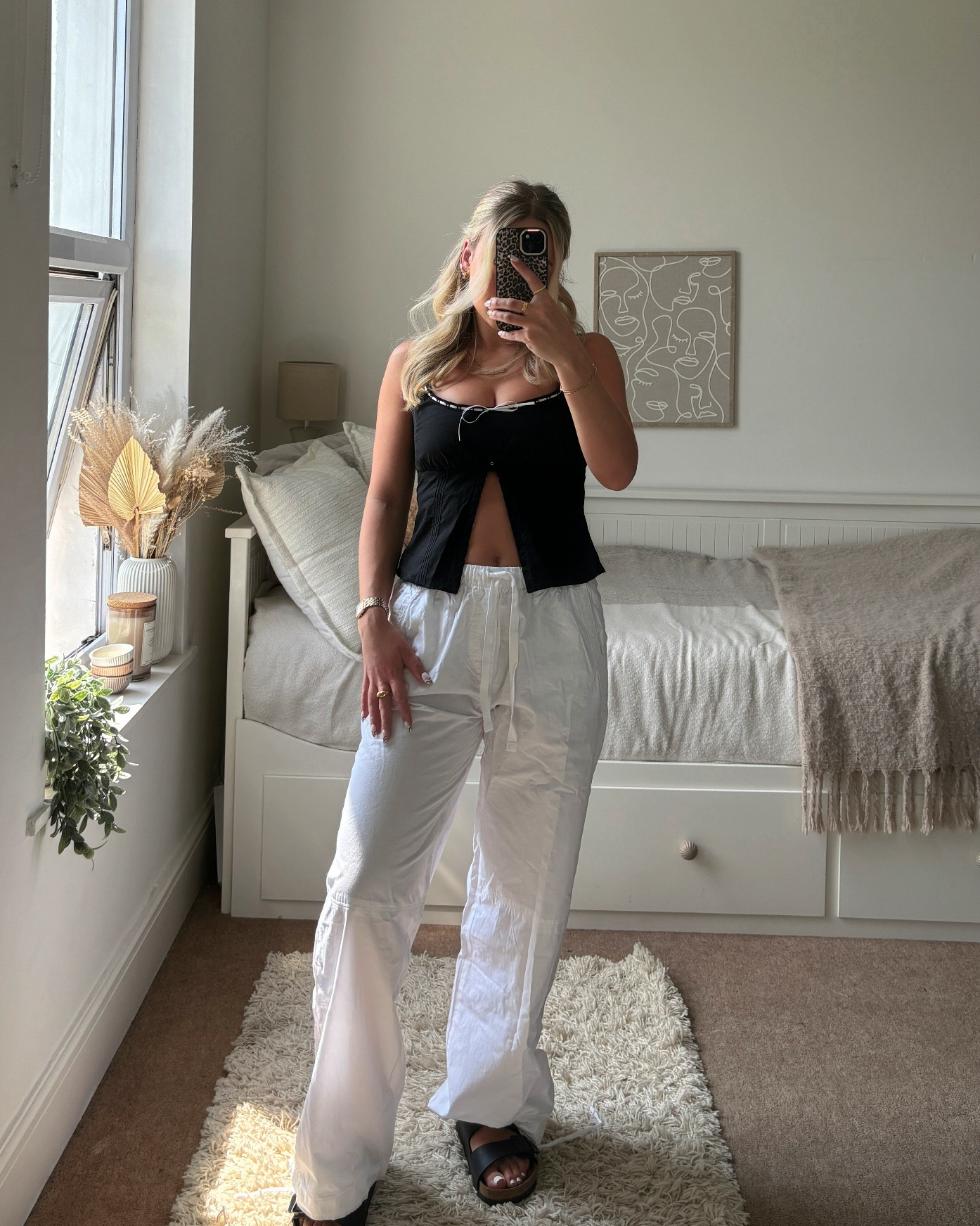 obsessed with this top 🎀🖤

styled two ways 🤍
1. white cargos
2. white linen mini skirt

spring outfit, summer outfit, milkmaid trend 

#LTKsummer #LTKeurope #LTKuk