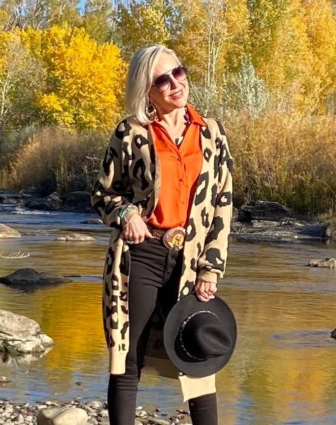 Leopard Print Shawl Neck Patch Pocket Open Front Duster Cardigan
Orange satin blouse
Black slim jeans 
Black western hat
Western belts 
Sunglasses
Booties

#LTKFindsUnder50 #LTKSaleAlert #LTKOver40