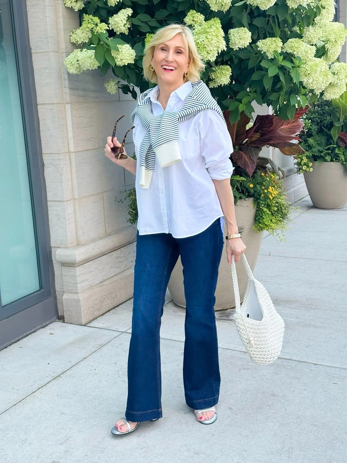 This is the kind of casual outfit I could live in. 🤍

I love the classic combination of a crisp collared shirt and jeans, but adding the striped sweatshirt over the shoulders gives it that little something extra. And can we talk about the silver shoes? They instantly make the whole look feel more fun and pulled together.

Sometimes it really is the simple styling tricks that make an everyday outfit feel special. ✨

#LTKSeasonal #LTKOver40 #LTKgrwm