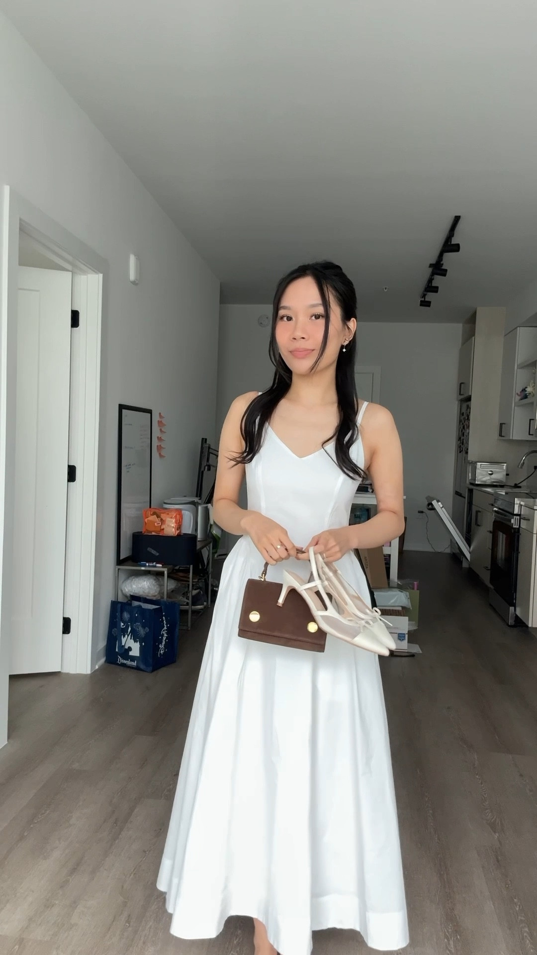 aritzia bright white technique poplin dress in size 00 paired with rsvp paris munchkin bag in chocolate suede - white kitten heels from amazon 

#LTKTravel #LTKFindsUnder100 #LTKWedding