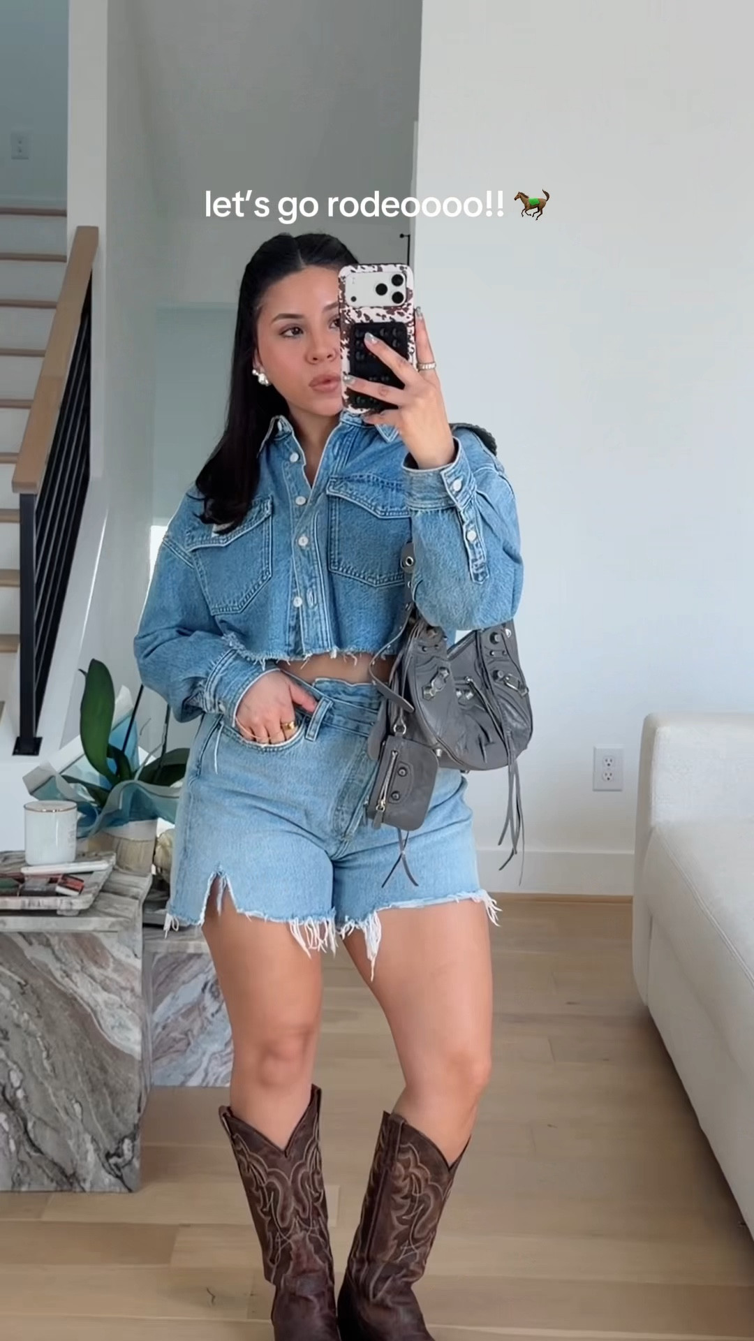 Rodeo outfit idea 
Silver earrings 
Denim on denim 
Cowgirl boots 
Balenciaga bag 

#LTKFestival #LTKgrwm #LTKootd