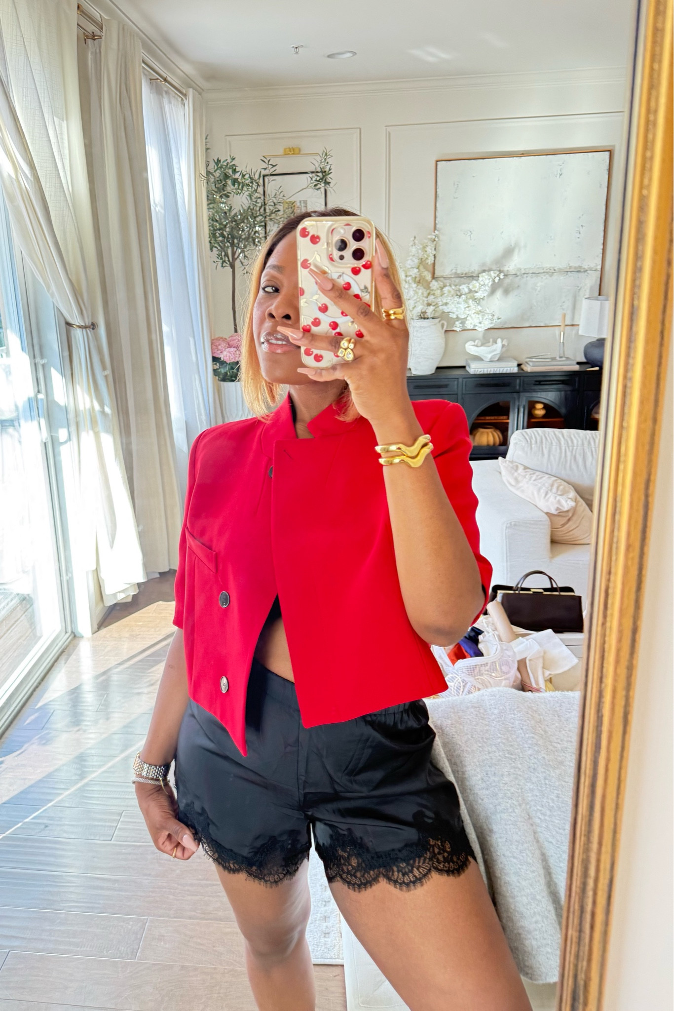 Red cropped blazer with a black satin lace shorts 

#LTKSeasonal #LTKMidsize
