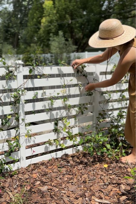 We added a white privacy fence to conceal our air conditioning units and planted jasmine that will grow in over time. Such an easy instant outdoor project. 

#LTKHome