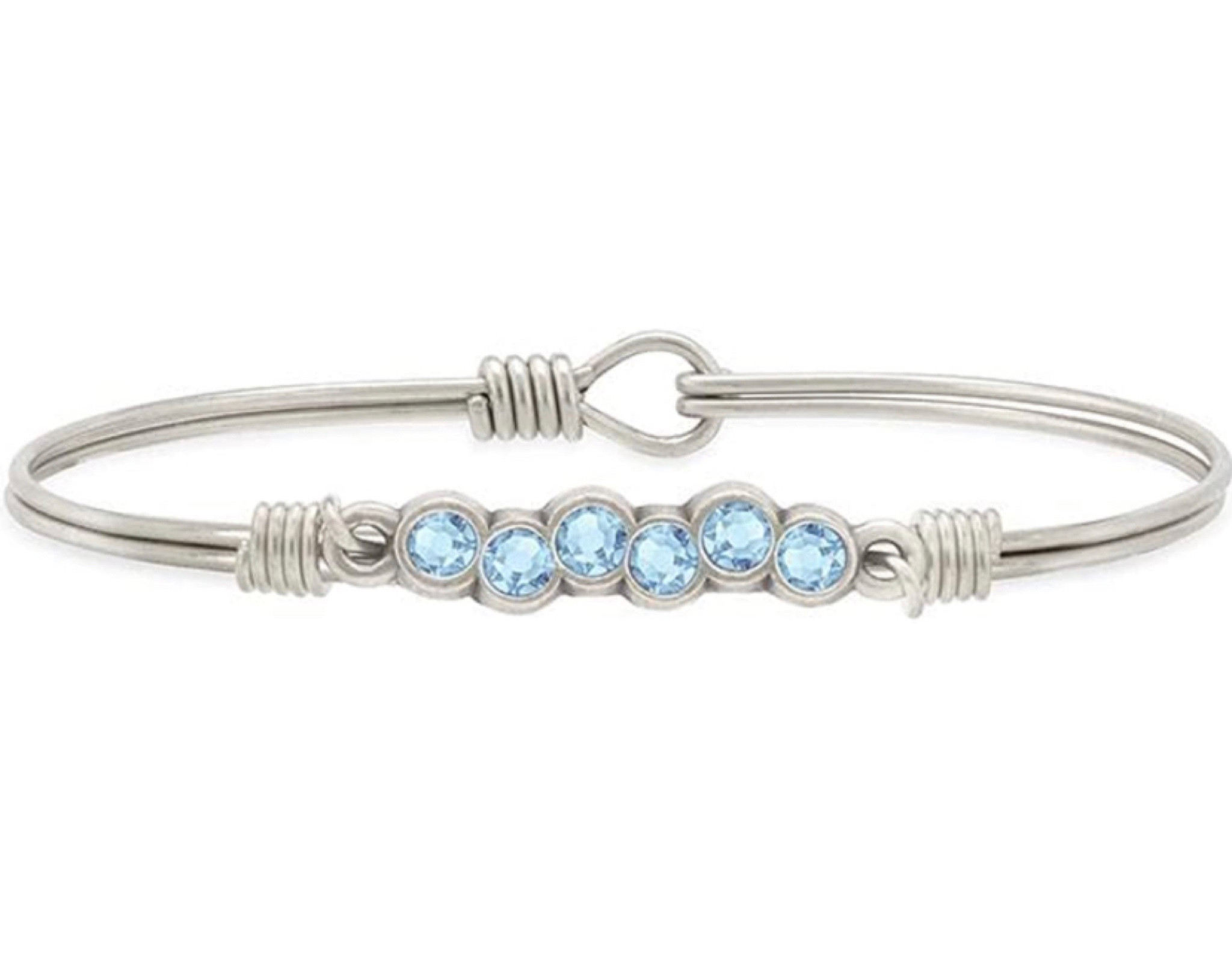 Luca + Danni March Starlight Birthstone Bangle Bracelet. The moments that really shine in your memory (think birthdays, anniversaries, milestones and more) deserve an equally-illuminating keepsake to commemorate. This handcrafted March birthstone bracelet takes the cake, with its row of delicate staggered crystals selected for courage, calming and happiness.

#LTKFind #LTKstyletip #LTKU