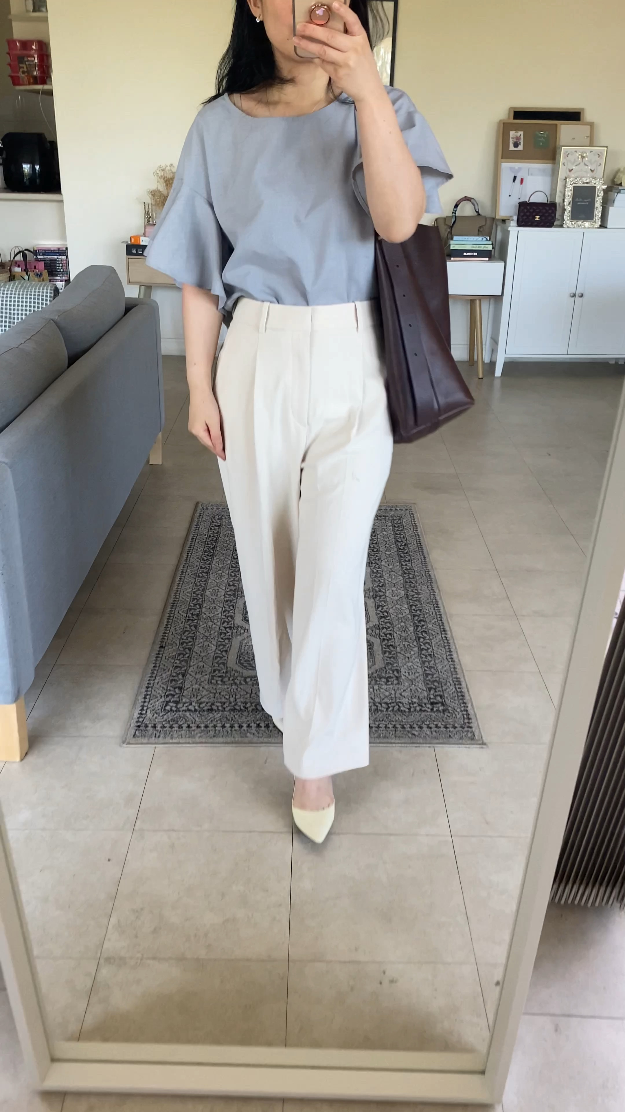 Smart and chic office style inspo for summer:
✨Grey flutter sleeve top (from random Korean brand). Have linked similar look in white which would also pair well with anything + is 100% cotton!
✨Uniqlo Wide leg pants XS. Comes in many colours, wearing cream version  I used the in store alteration service and got the hems taken up for AU$6. Well worth it!
✨Madewell bucket bag in chocolate raisin. Love, love, love this bag! 🤎 I thought the dark brown would be good for autumn but I’ve been using it all summer and it goes with everything. 
✨Jimmy Choo Romy 85 patent white. Have owned for many years and have been unable to find something similar in as good quality so if you find it on pre-loved market, would recommend as investment piece. 
👍
#petitestyle #officewearstyle #minimalistchic

#LTKaustralia #LTKitbag #LTKworkwear