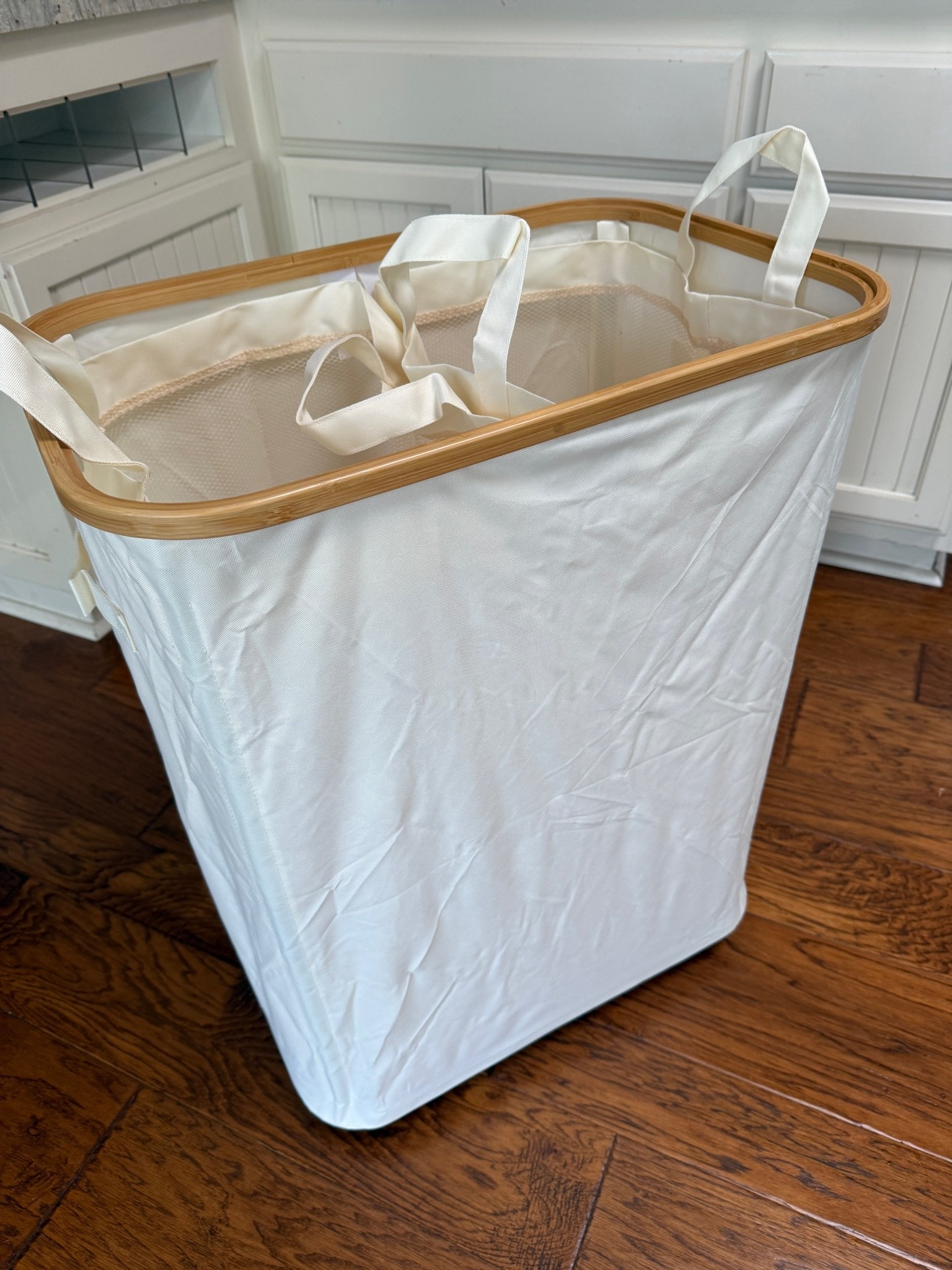 Two sided hamper on wheels.