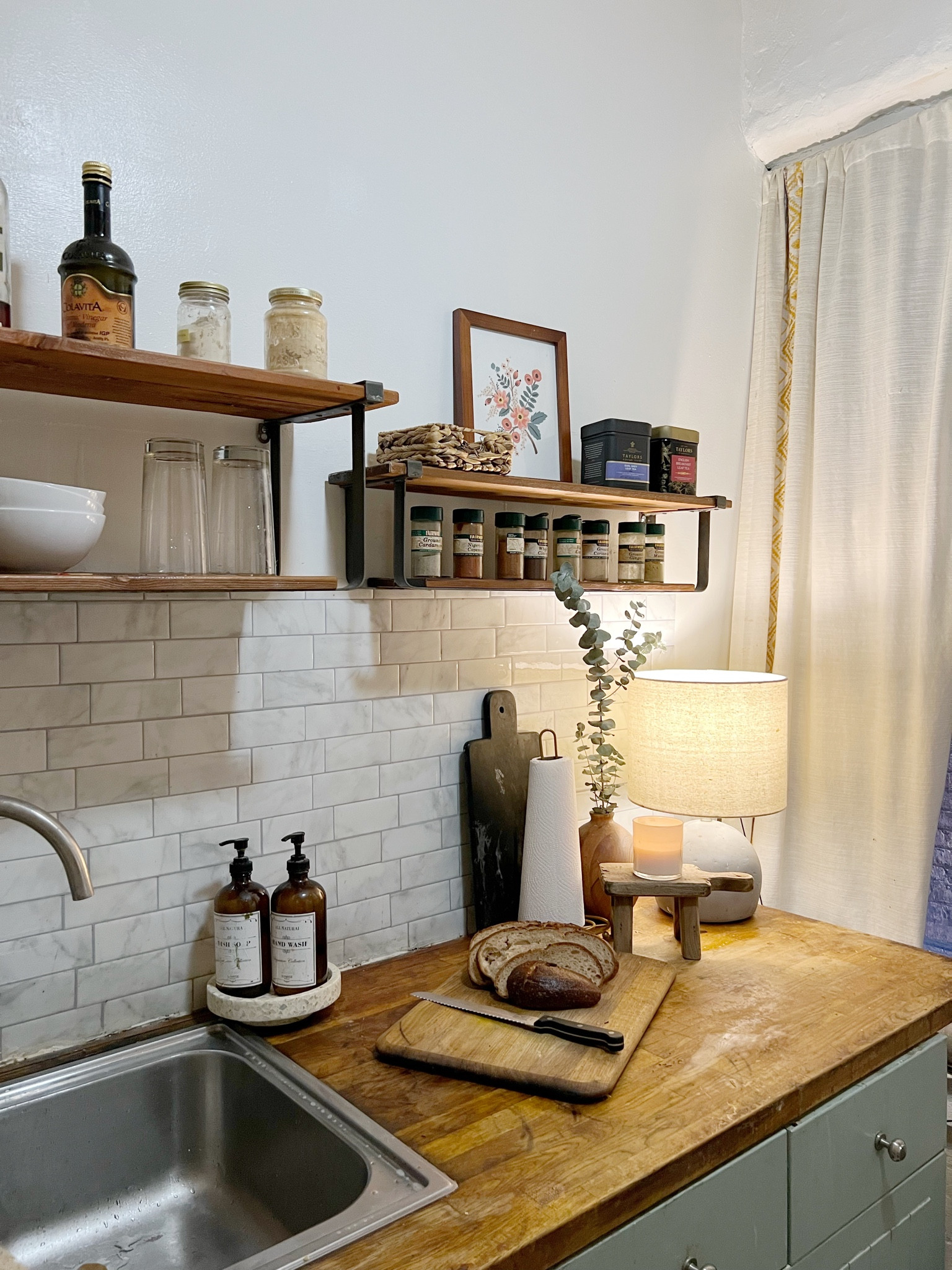 What is shelves, peel and stick tile, concrete lamp, dish soap, dispenser, paper, towel holder

#LTKFind #LTKhome #LTKSale