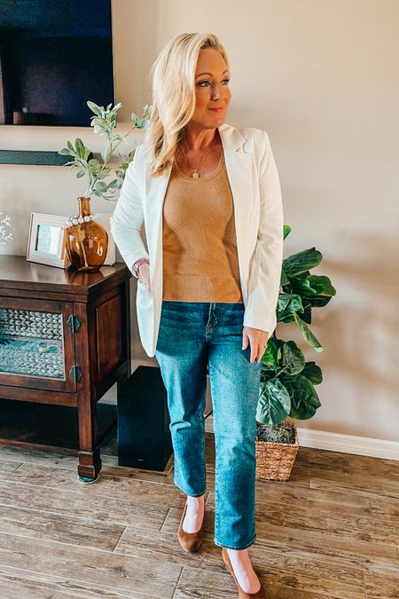If you struggle to find jeans that fit in length, I highly recommend you try Madewell. I went into the store and tried on several styles and landed on these. Mid-rise Perfect Vintage Jean, Deming Wash. I am a smidge over 5’2, so petite can sometimes be too short and standard fit too long. 

Madewell has tailors that will customize the length where you want it at no additional cost. I wanted an ankle length since we live in a warm climate so that I can wear my sandals with them this fall & winter! 

White blazer
White tailored jacket 
Camel sweater tank top
Wedge Clark shoes 
Bracha Pendant Initial Necklace 
Rattan earrings 

#LTKxMadewell #LTKsalealert #LTKover40