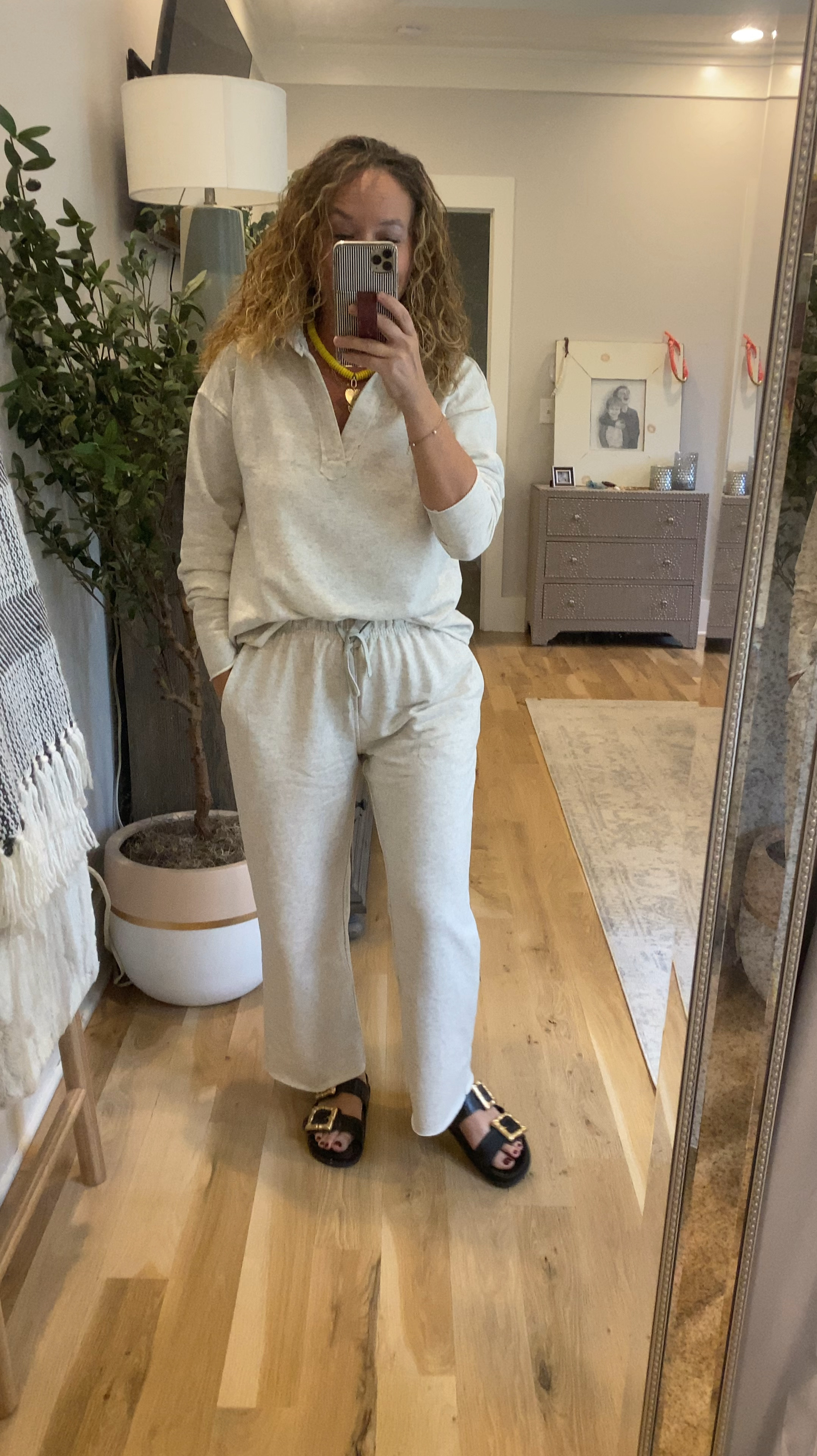 Designer look for less lounge set!  Perfect for lounging, travel, working from home or running errands!

Love the raw hem detail on both pants and top, drawstring pants, soft fabric, v-neck style top!

Comes in 7 colors, this is the light gray oatmeal color.  Only $55.99!!

Designer version linked too!

Over 40 style, fashion over 40, lounge set, gray lounge set, look for less, travel set

#LTKFindsUnder100 #LTKOver40 #LTKStyleTip