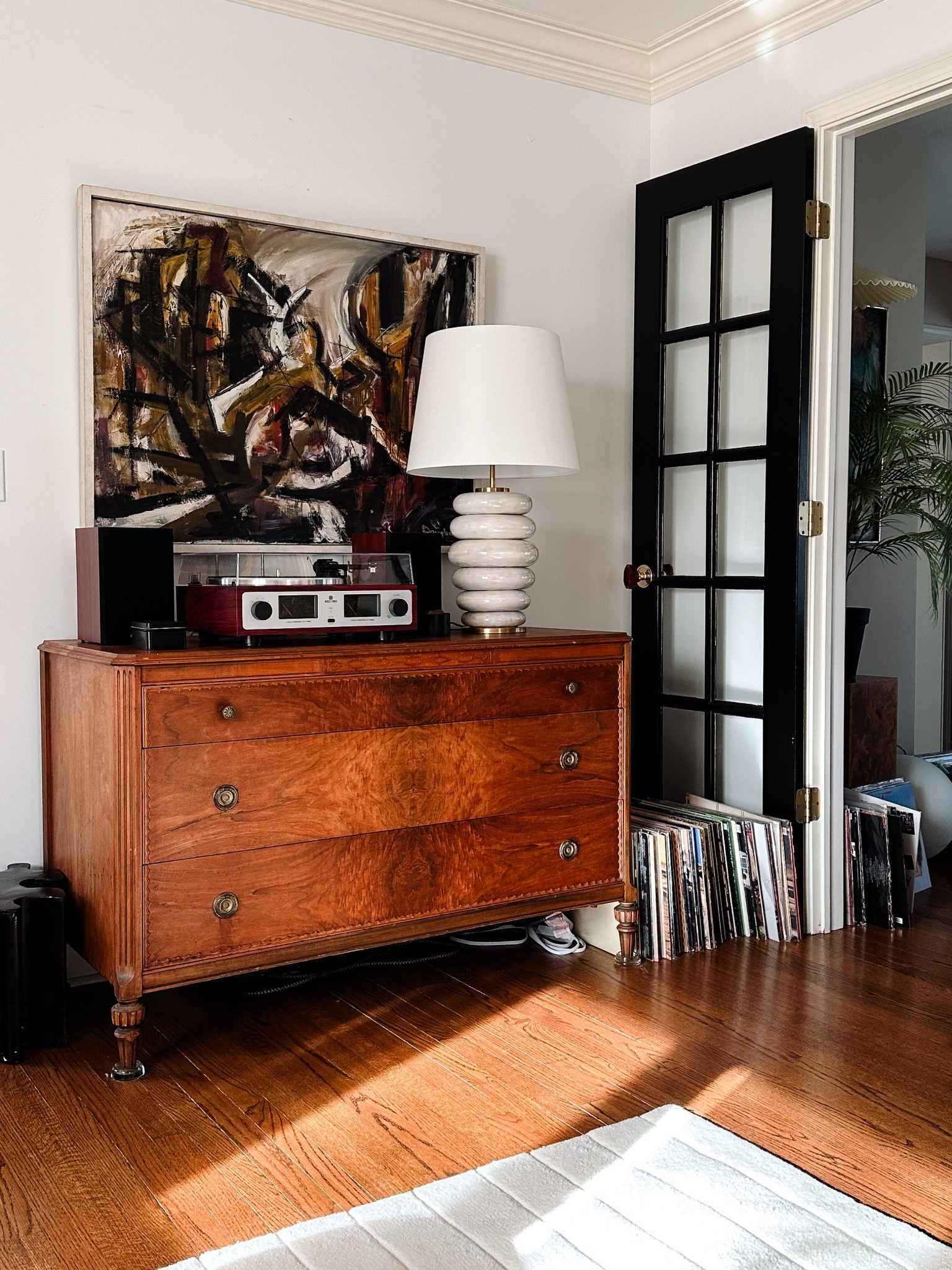 Vintage decor with a modern twist. Vintage abstract art - linked similar. Kelly Wearstler lamp and old antique dresser with a retro record player (with that are Bluetooth and smart phone compatible) 

Living room decor ideas for an eclectic decor style, neutral decor, neutral aesthetic, vinyl, records, record player, antique chest of drawers, room ideas aesthetic, luxury living room, cozy living room, modern table lamp, 

#LTKHome