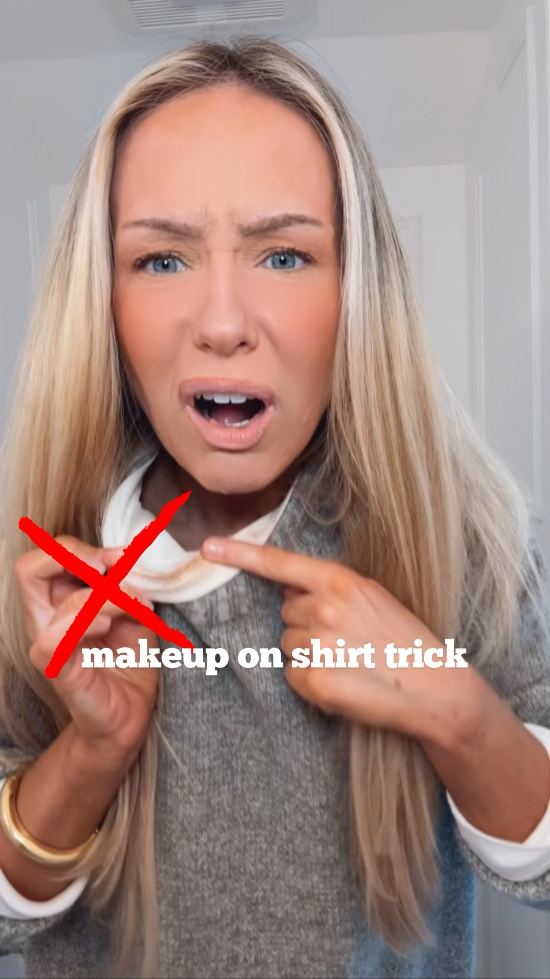Fashion trick to help prevent makeup from transferring on your shirt when putting it on! 💫✨