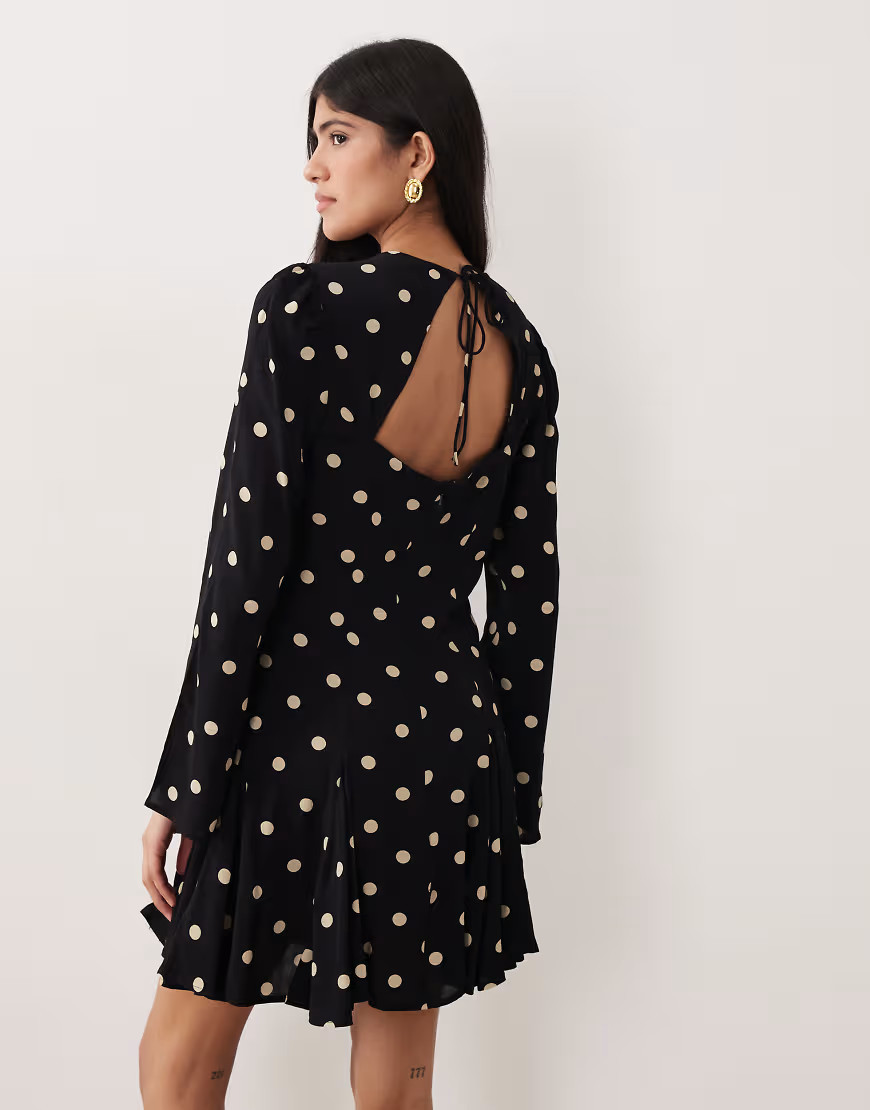 Nobody's Child Paris cut out back fluted hem mini dress in black polka dot | ASOS (Global)