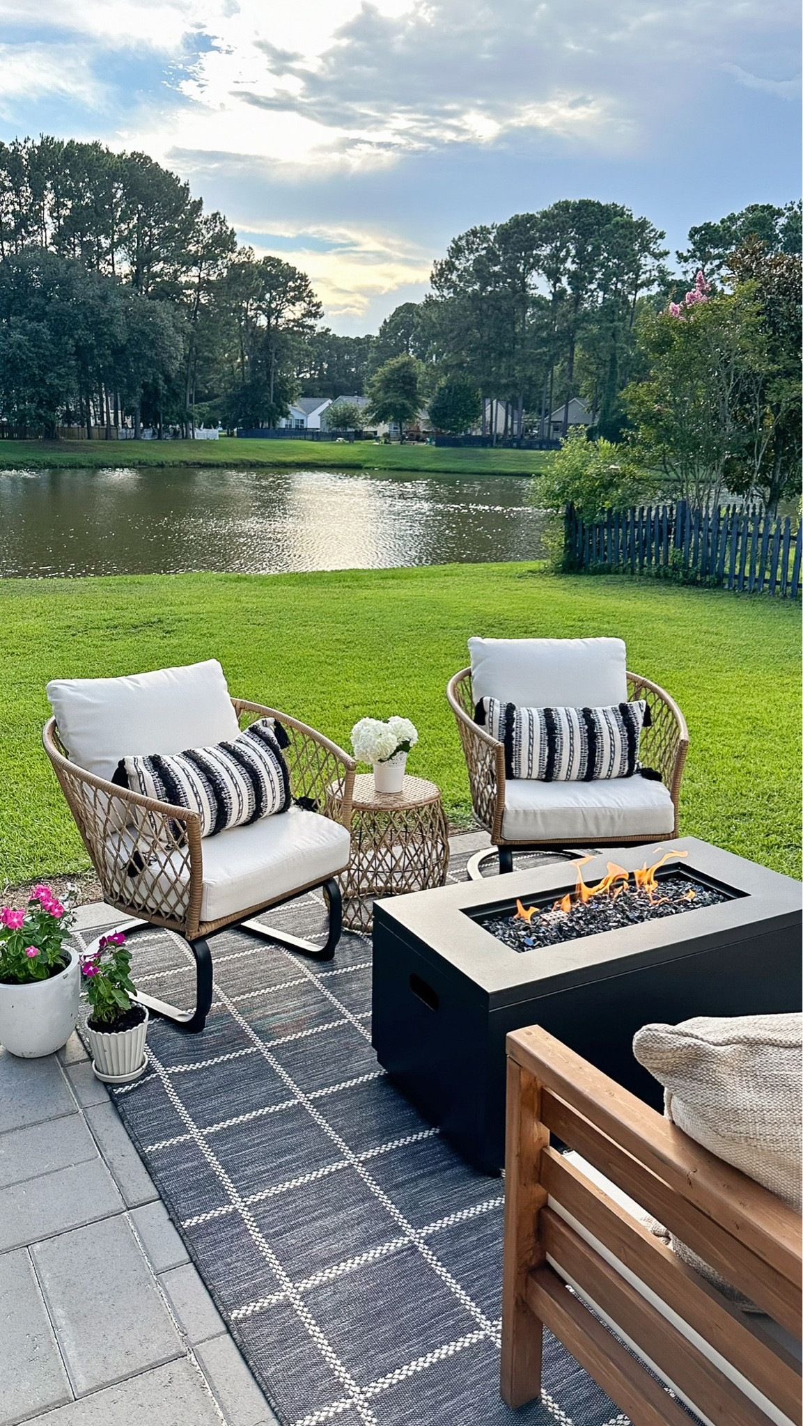 Outdoor living space with outdoor furniture and decor from Walmart, smokeless fire pit, wicker outdoor chair and table set, throw pillows

#LTKSaleAlert #LTKHome #LTKSeasonal
