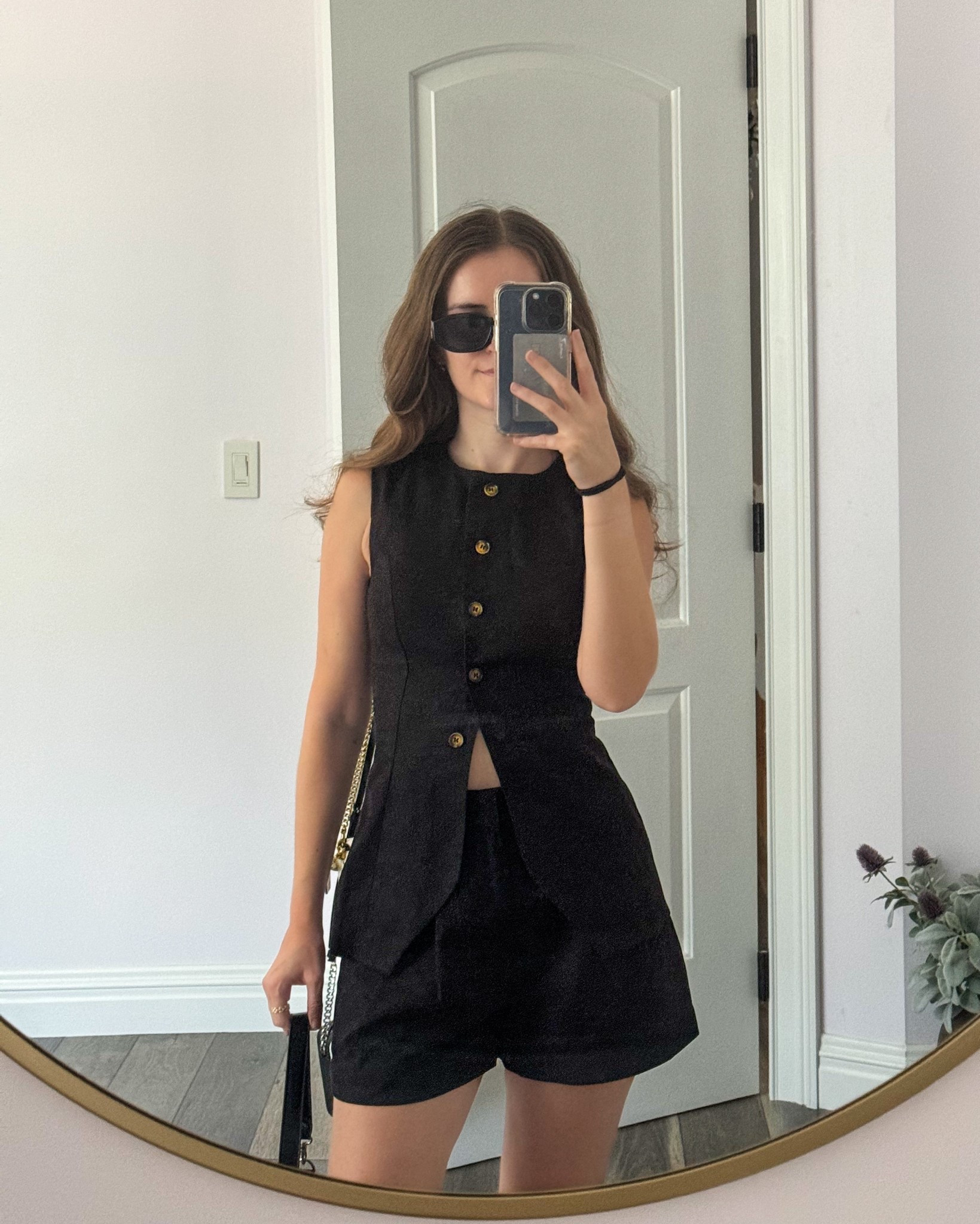 A summer set with a linen vest and  linen shorts paired with a shoulder bag and black sandals  makes a classy summer outfit ideas.
.
.
.
.
.
#LTKSummerEdit #LTKGiftGuide #LTKSeasonal #LTKU #LTKSaleAlert #LTKPetite #LTKFindsUnder50 #LTKFindsUnder100 #LTKStyleTip #LTKTravel #LTKShoeCrush #LTKItBag #

Summer outfits | old money outfits | European summer outfits | vest outfits | vest set | vest top | vest and shorts set | black vest outfits | button up vest | button down vest | high neck vest | linen vest set | linen vest outfit | vest suit | shorts outfit | black shorts outfit | dress shorts | linen shorts outfit | black tailored shorts | trouser shorts | summer shoes | outfit inspo | classy outfits | black sandals | 