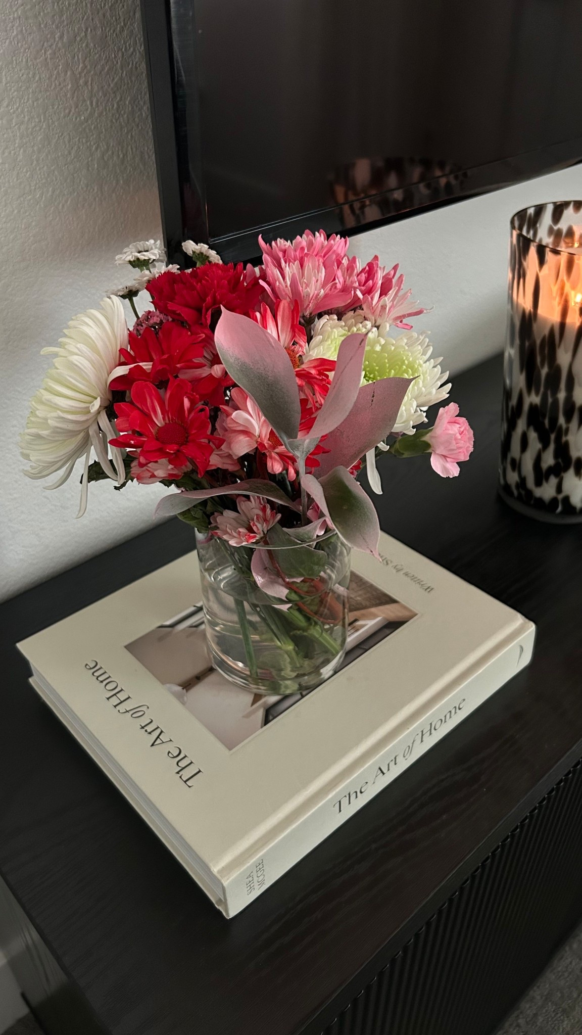 Fresh flowers from my daughter, a pretty coffee table book, and a freshly lit candle are what make me happy 🤎 

#LTKHome #LTKmomlife