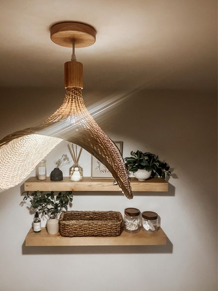 Obsessed with my new rattan amazon light pendant 🤩 spa vibes 

Bathroom decor, shelf styling, floating shelves, light fixture 

#LTKhome