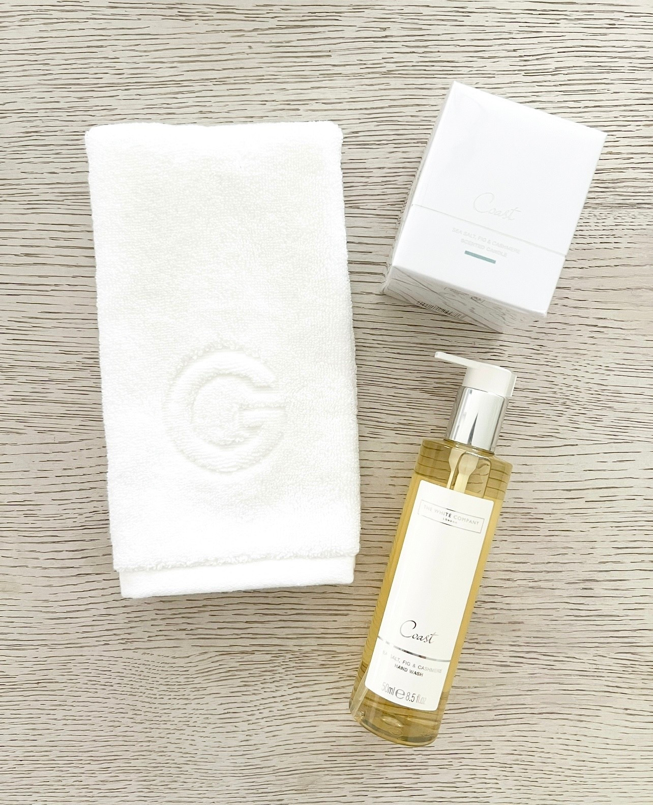 This classic and coastal inspired gift assortment would be perfect to give as a hostess gift, housewarming gift, or to yourself. It features a luxuriously soft matouk fingertip towel with a monogrammed letter of choice, a coast scented hand soap & a matching scented candle perfect for a powder room or guest bathroom. The best part is all of the items are currently on sale. 

#LTKHome #LTKSeasonal #LTKSaleAlert
