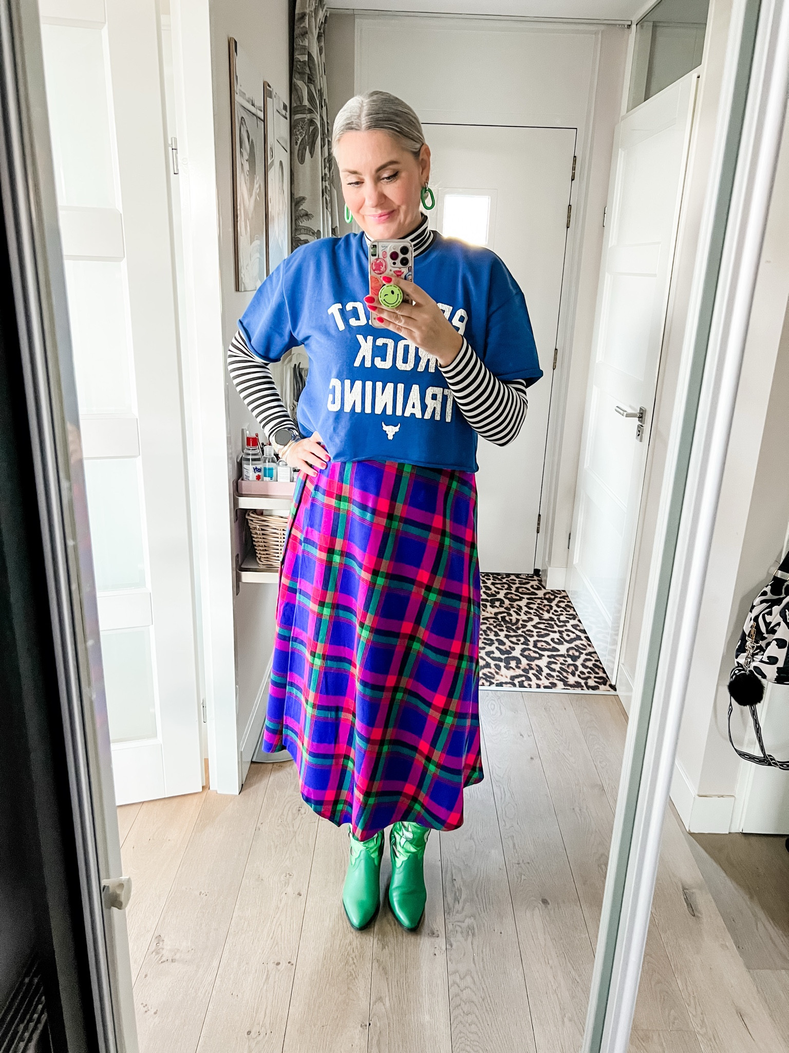 Ootd - a Royal blue Under Armour crop top over a striped turtleneck longsleeve shirt paired with a plaid skirt which was a collab between an Italian brand and African artisans and green western boots (old, Sacha). 



#LTKstyletip #LTKeurope #LTKspring