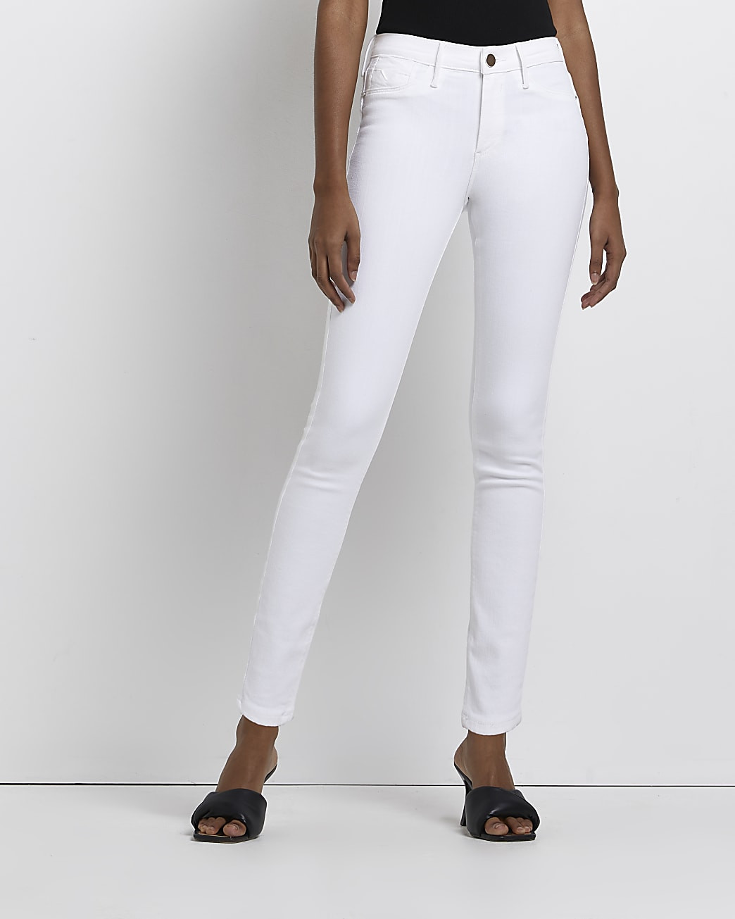 White molly mid rise bum sculpt skinny jeans | River Island (UK & IE)