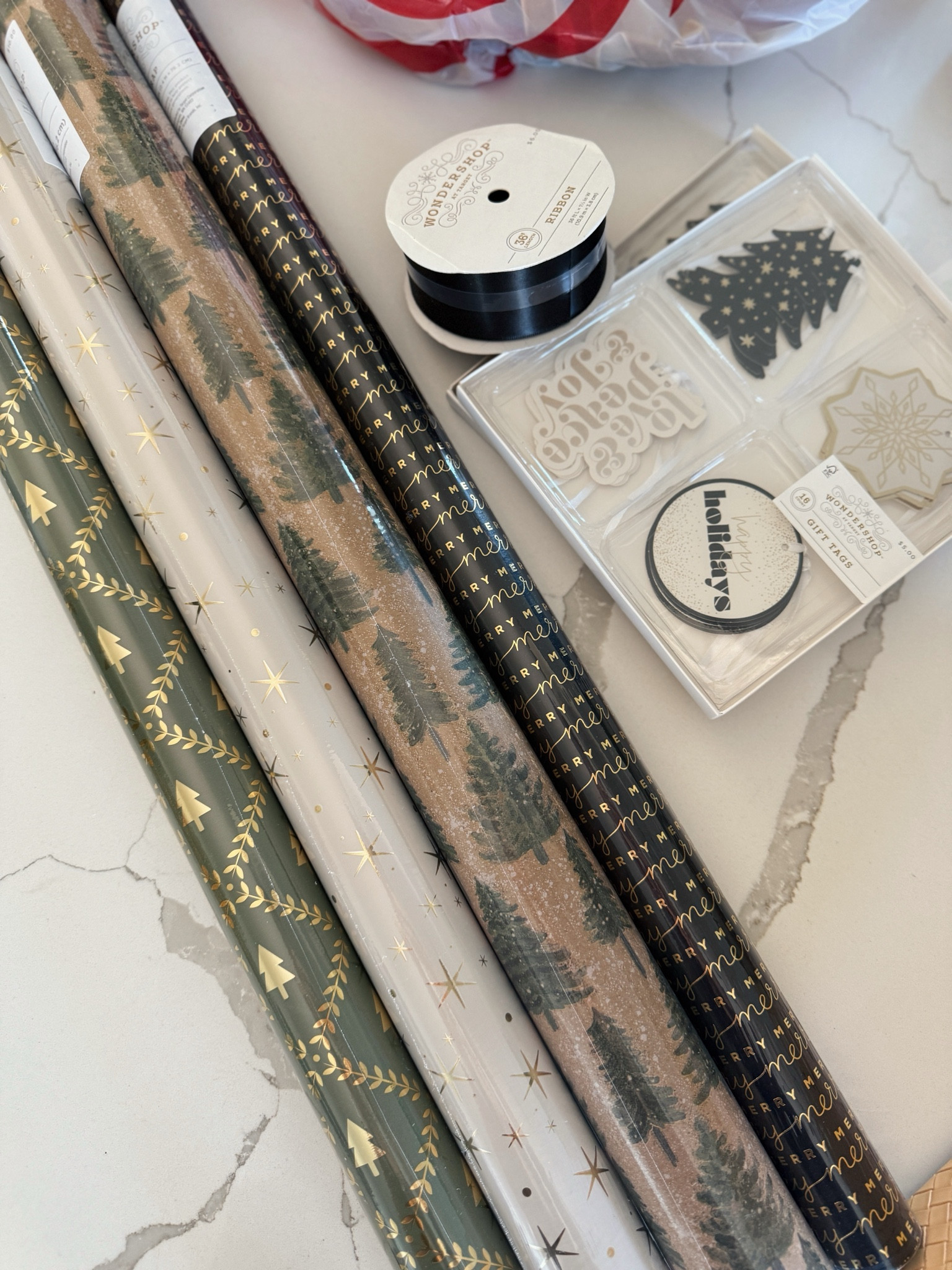 The best Target holiday wrapping paper! Also this $5 black satin ribbon 🤌

#LTKFindsUnder50 #LTKHoliday #LTKHome