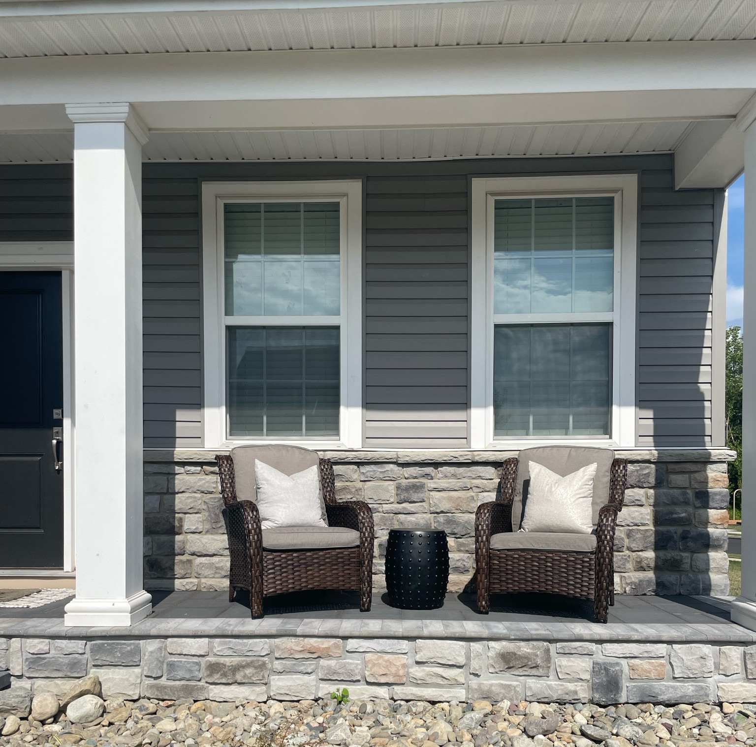 Traditional porch decoration. King wicker chairs with two feathered pillows and side table creating a beautiful space to enjoy fellowship and coffee

#LTKFamily #LTKHome