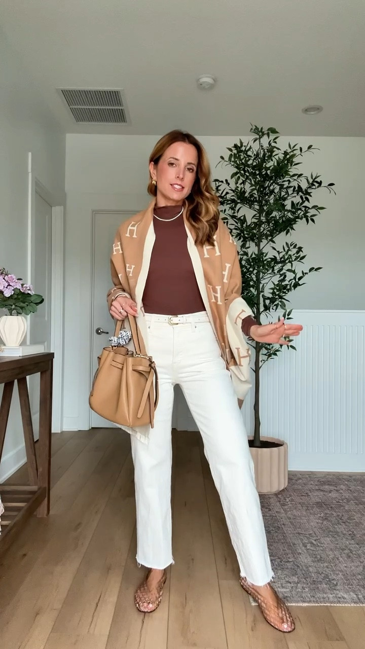 My spring outfit of the day! Elevated casual outfit. Mom outfit. Cream wide leg crop jeans in 24 regular - I did regular since it’s a crop style and I wanted full length. Amazon reversible pashmina shawl. Seamless mockneck top in XS. XS in belt. Dolce Vita flats are whole sizes only - I am a 6.5 and sized down per reviews and they fit perfectly! Tory Burch Romy Bucket bag. 


#LTKgrwm #LTKdayinmylife #LTKootd