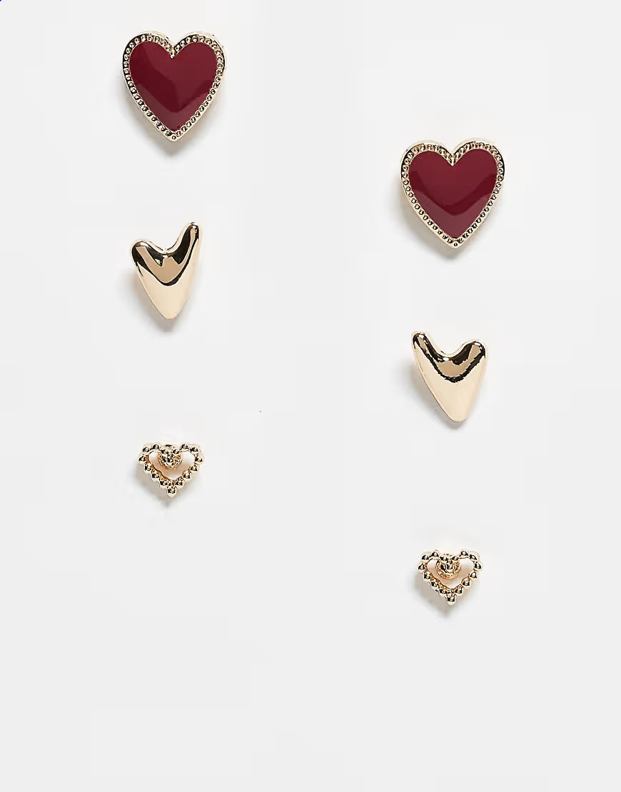 ASOS DESIGN 3 pack of stud earrings with heart design in gold and burgundy enamel | ASOS (Global)