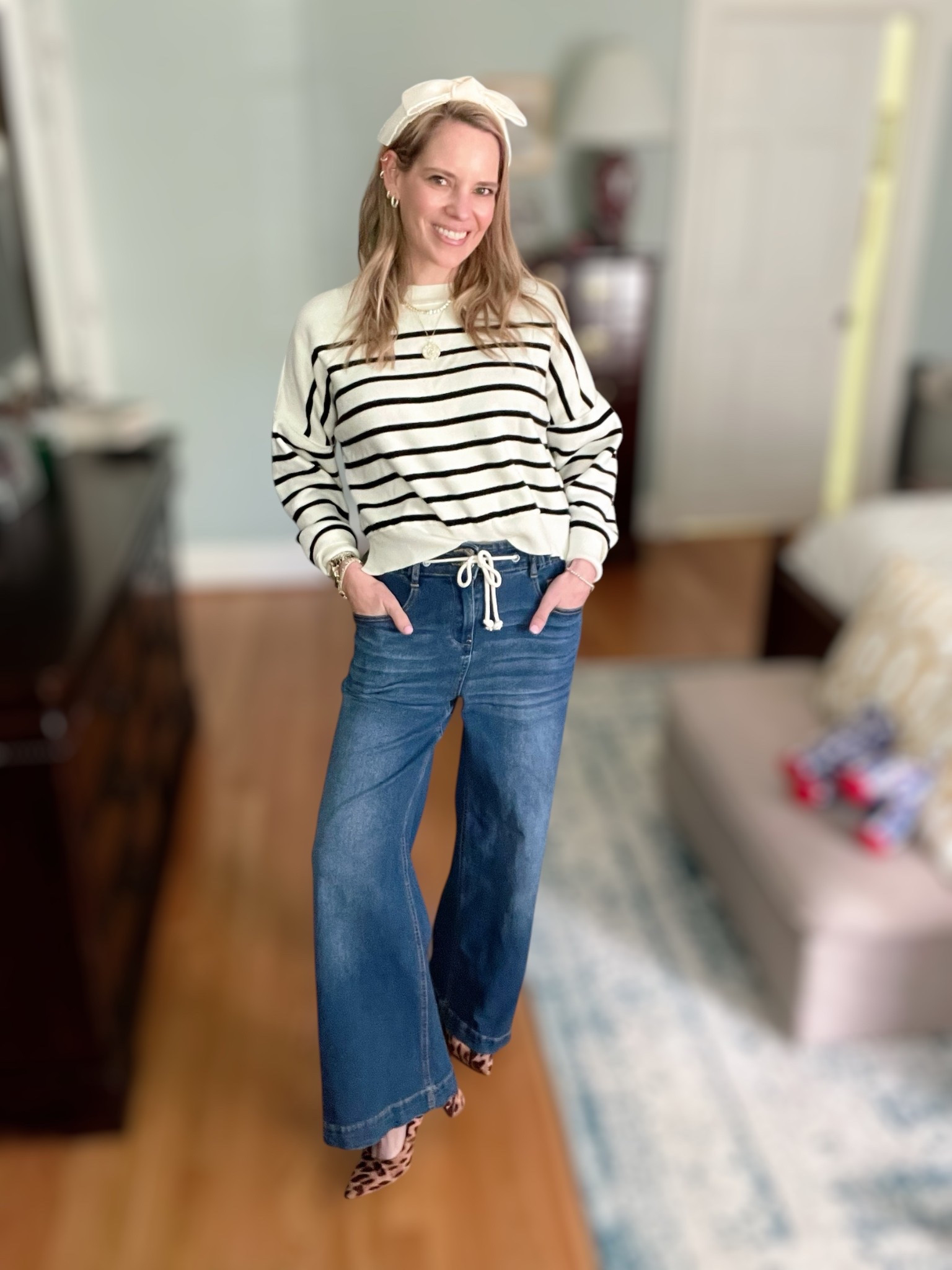 Use code ASHLEYBA for 10% off all Melinda Maria jewelry + FREE 1” Diamondette Hoops with purchase through 4/15! ✨💎

This classic-meets-coastal outfit is all about comfort, polish, and a touch of sparkle 🖤🤍🌊. I’m wearing a lightweight striped sweater, wide-leg denim with a drawstring waist, and the ultimate spring accessories — including a bow headband, leopard heels for a pop of print, and Melinda Maria favorites that elevate it all ✨👜

Melinda Maria Jewelry Details:
	•	Coin pendant necklace with celestial sparkle 🌙✨
	•	Tennis choker layered for just the right amount of glam 💫
	•	Stacked rings in gold + diamondette for that “collected over time” look 💍
	•	Tennis bracelets on repeat — classic, polished, and versatile
	•	1” Diamondette Hoops — FREE GWP through 4/15!

Styled with an engraved Abbott Lyon watch, a beaded Coach camera bag, and playful layers that keep the look cool, coastal, and put together for errands, brunch, or travel days.

wide leg jeans outfit spring, classic striped sweater look, elevated casual outfit 2025, coastal chic spring fashion, Melinda Maria coupon code, free gift with purchase jewelry, everyday jewelry stack, tennis bracelet layered look, Coach camera bag with beaded strap, leopard heels outfit, casual glam outfit idea

#LTKFindsUnder50 #LTKOver40 #LTKFindsUnder100