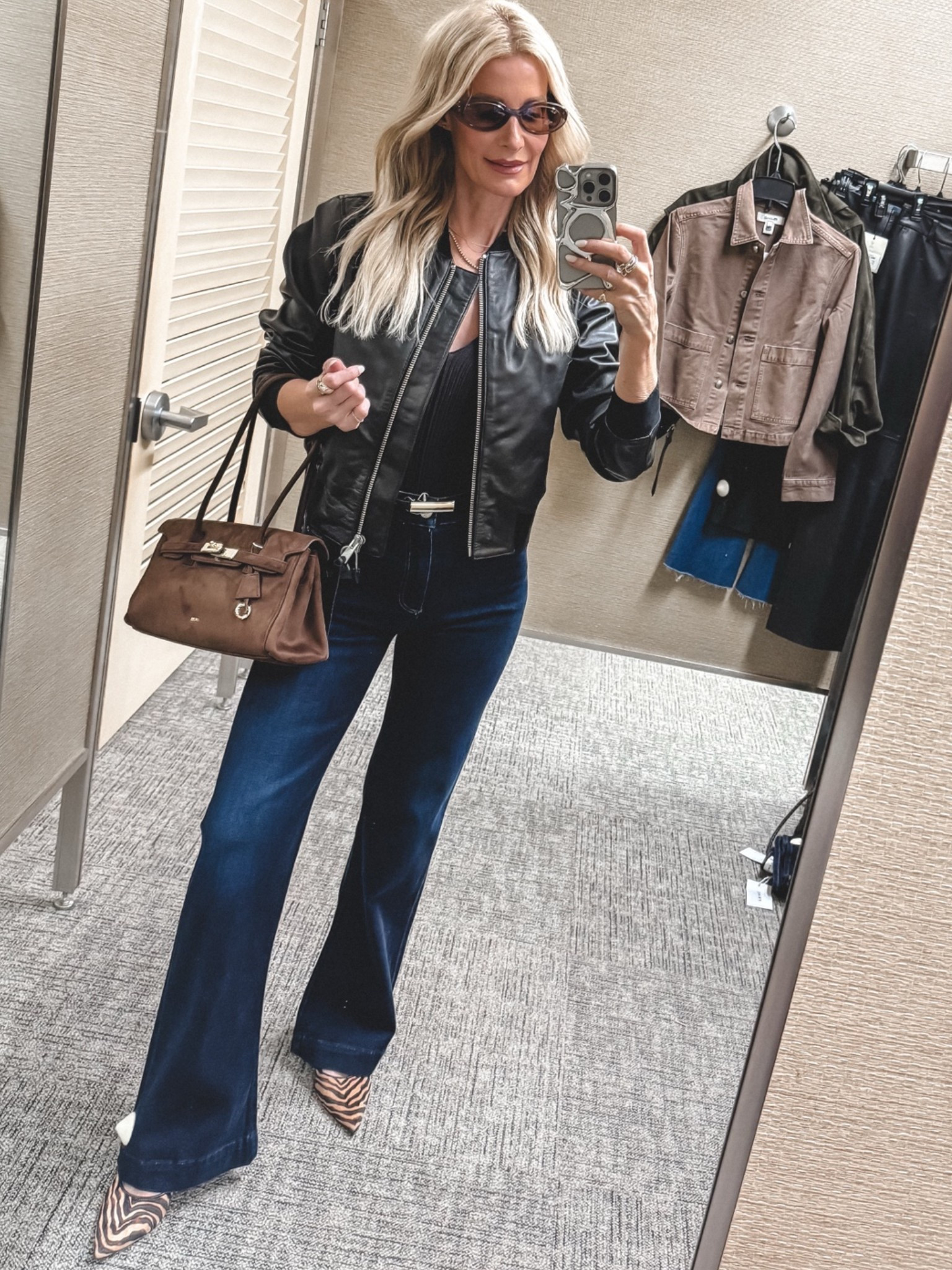 Entire look is part of the Nordstrom Anniversary Sale. ✨ This black leather bomber jacket is such a timeless investment piece. I’m wearing an XS. I paired it with these Paige high-rise wide-leg dark wash jeans that are so flattering and guaranteed to give you legs for days. The brown suede bag and zebra heels are also part of the sale. I’m wearing a size 24 in the jeans

#LTKootd #LTKOver40 #LTKSaleAlert