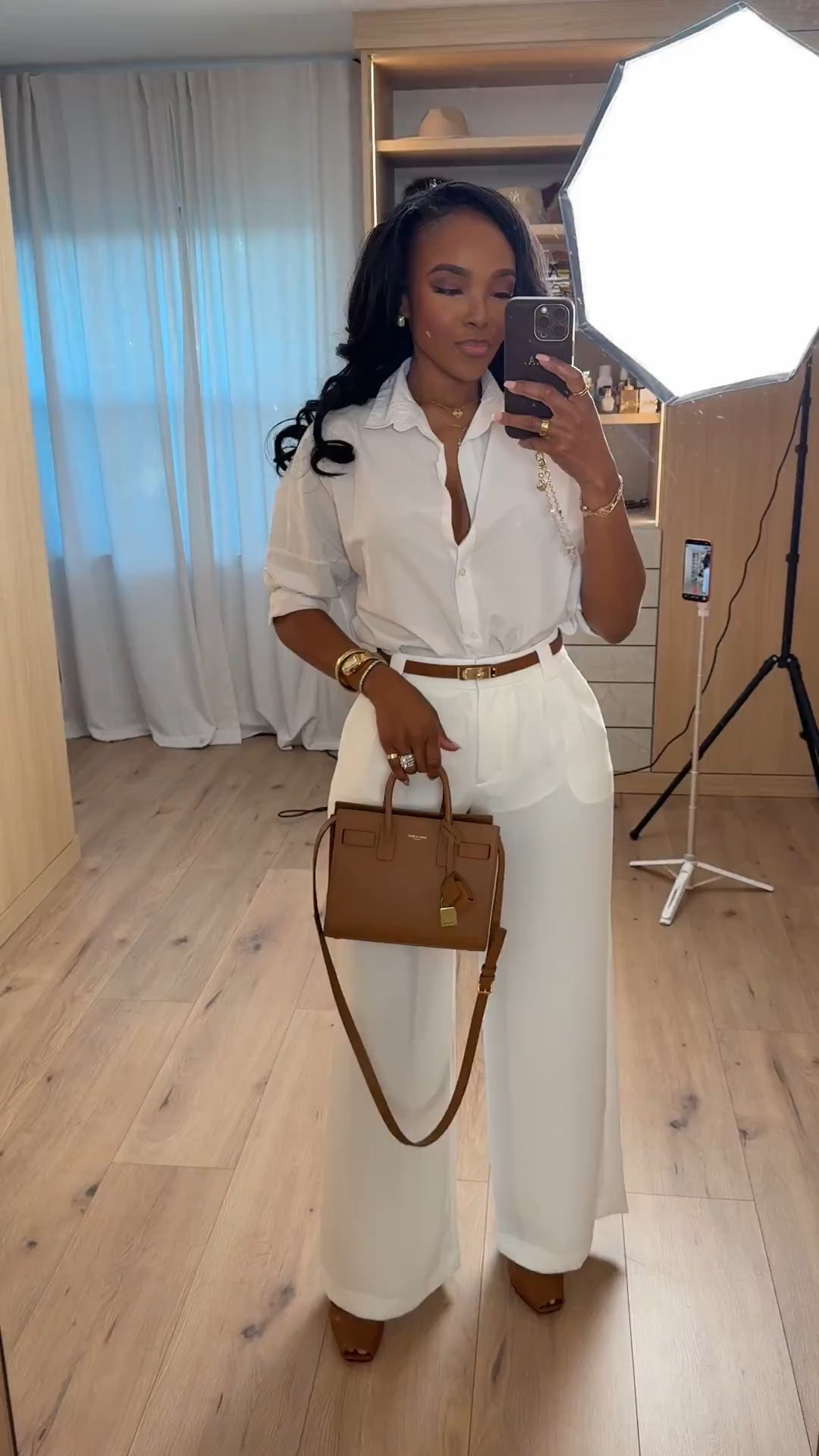 Clean, polished, and effortlessly elevated 🤍 This monochrome cream look is the definition of timeless luxury — a crisp button-down styled with tailored wide-leg trousers and warm tan accessories for that understated rich mom energy. Styled multiple ways, this is the kind of set that makes your cost per wear drop instantly and fits into a long-term shopping strategy.

Perfect for brunch dates, business casual meetings, church, graduations, spring events, or elevated everyday errands.

Tap to get details and recreate this look instantly ✨

📏 Sizing:
Top: Small  
Trousers: 4 Long  
Shoes: True to size  
Height: 5'4" | Weight: 138 lbs | Bust: 34D | Waist: 27" | Hips: 40”

This neutral wide leg trouser outfit is perfect for capsule wardrobe styling, classic feminine outfits, cream monochrome looks, elevated everyday fashion, business casual inspiration, luxury minimal style, and chic spring outfit ideas that never go out of style.

Follow me on Instagram and YouTube @kirasfashionfinds