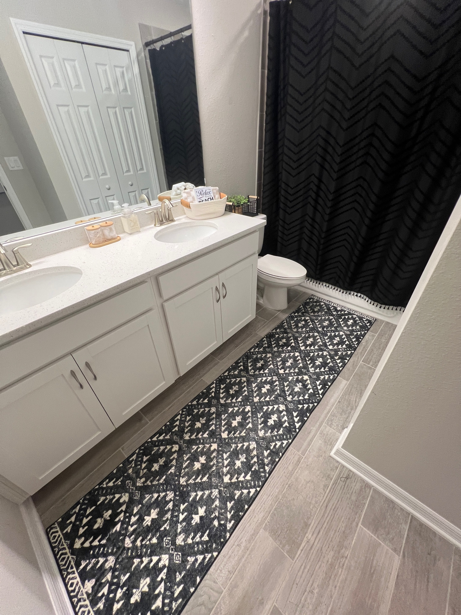His bathroom 🖤 
Have I mentioned how much I can’t stand individual bath rugs? Style tip, opt for a runner instead of 3 different rugs! This 8ft fit perfectly in our space  Can’t tell you how many guests have said how soft it is 😍

Amazon home, Home Decor

#LTKFindsUnder50 #LTKHome #LTKStyleTip